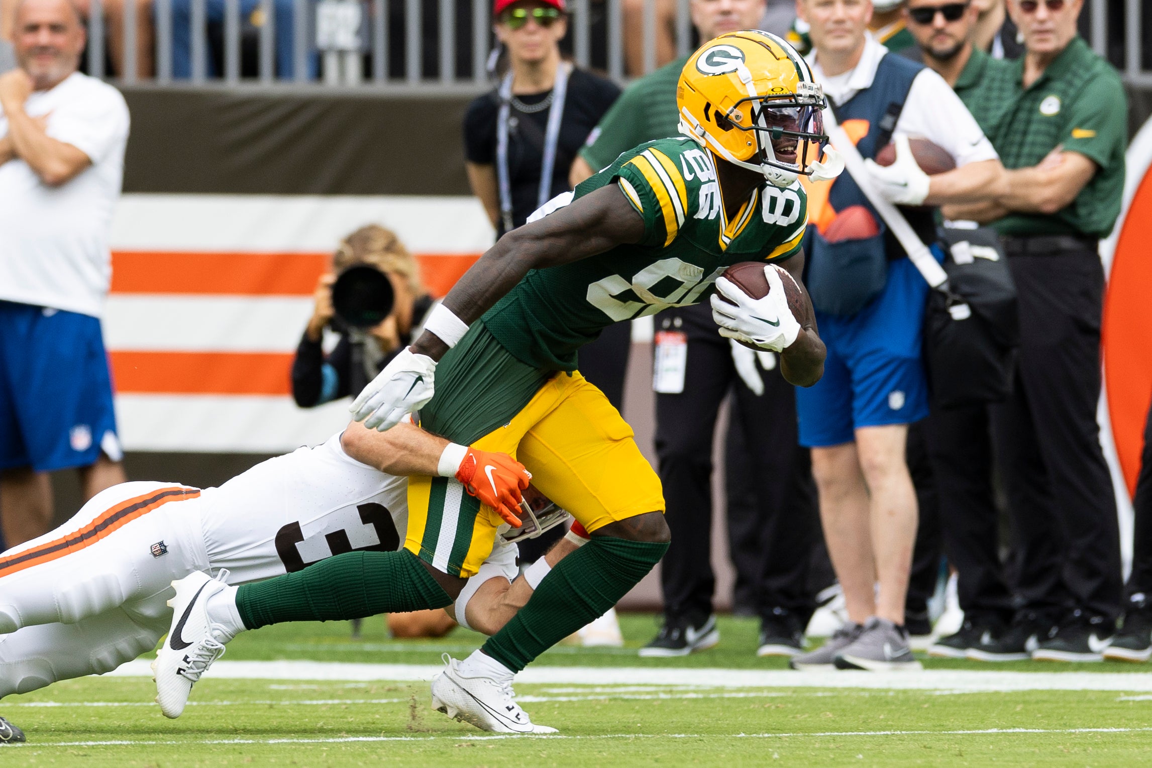 Aug 10, 2024; Cleveland, Ohio, USA; Green Bay Packers wide receiver Grant DuBose (86) runs the ball as Cleveland Browns safety Brady Breeze (39) tackles him during the first quarter at Cleveland Browns Stadium.