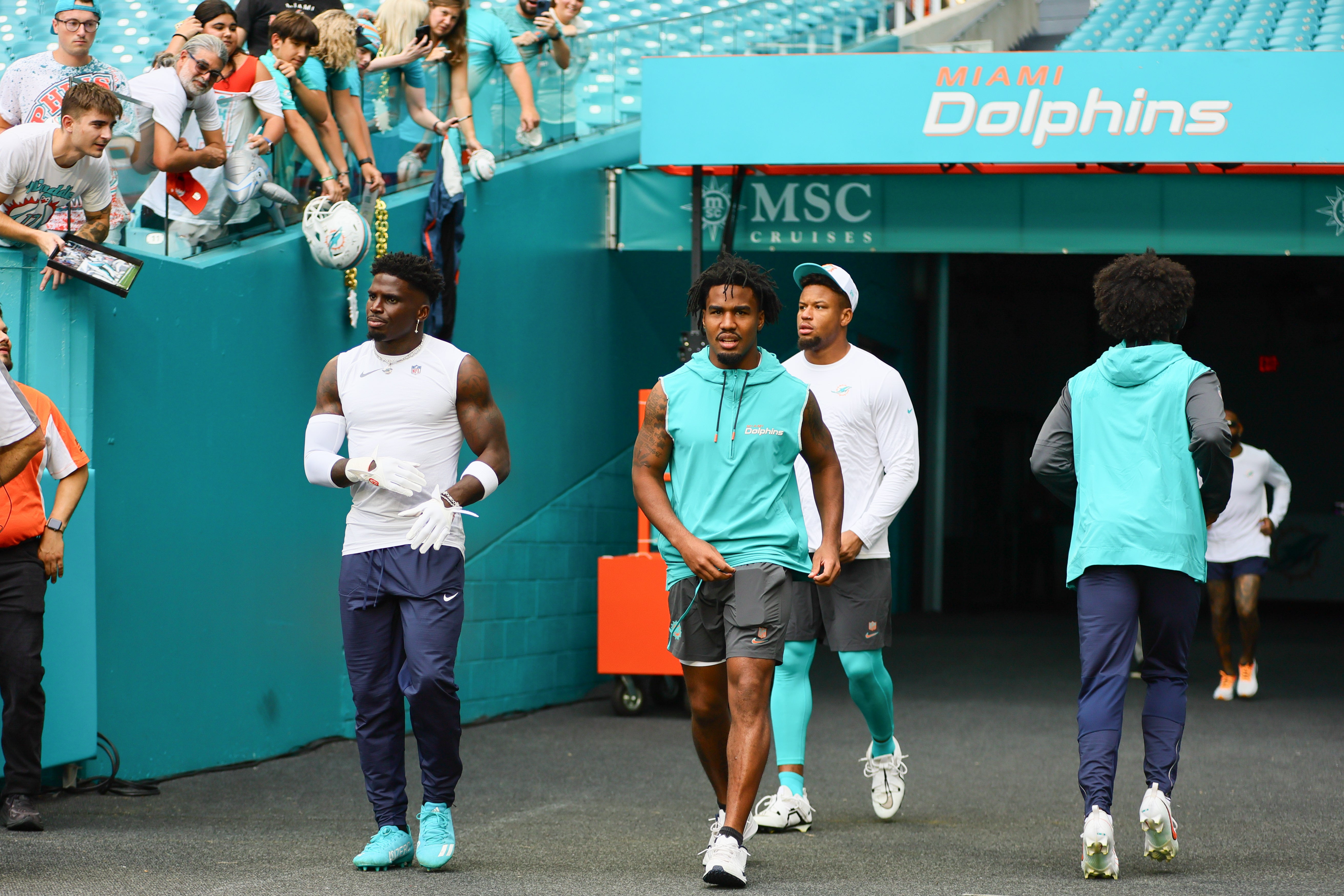 Aug 17, 2024; Miami Gardens, Florida, USA; Miami Dolphins wide receiver Tyreek Hill (10) and wide receiver Jaylen Waddle (17) take on the field for warmups before a preseason game against the Washington Commanders at Hard Rock Stadium.