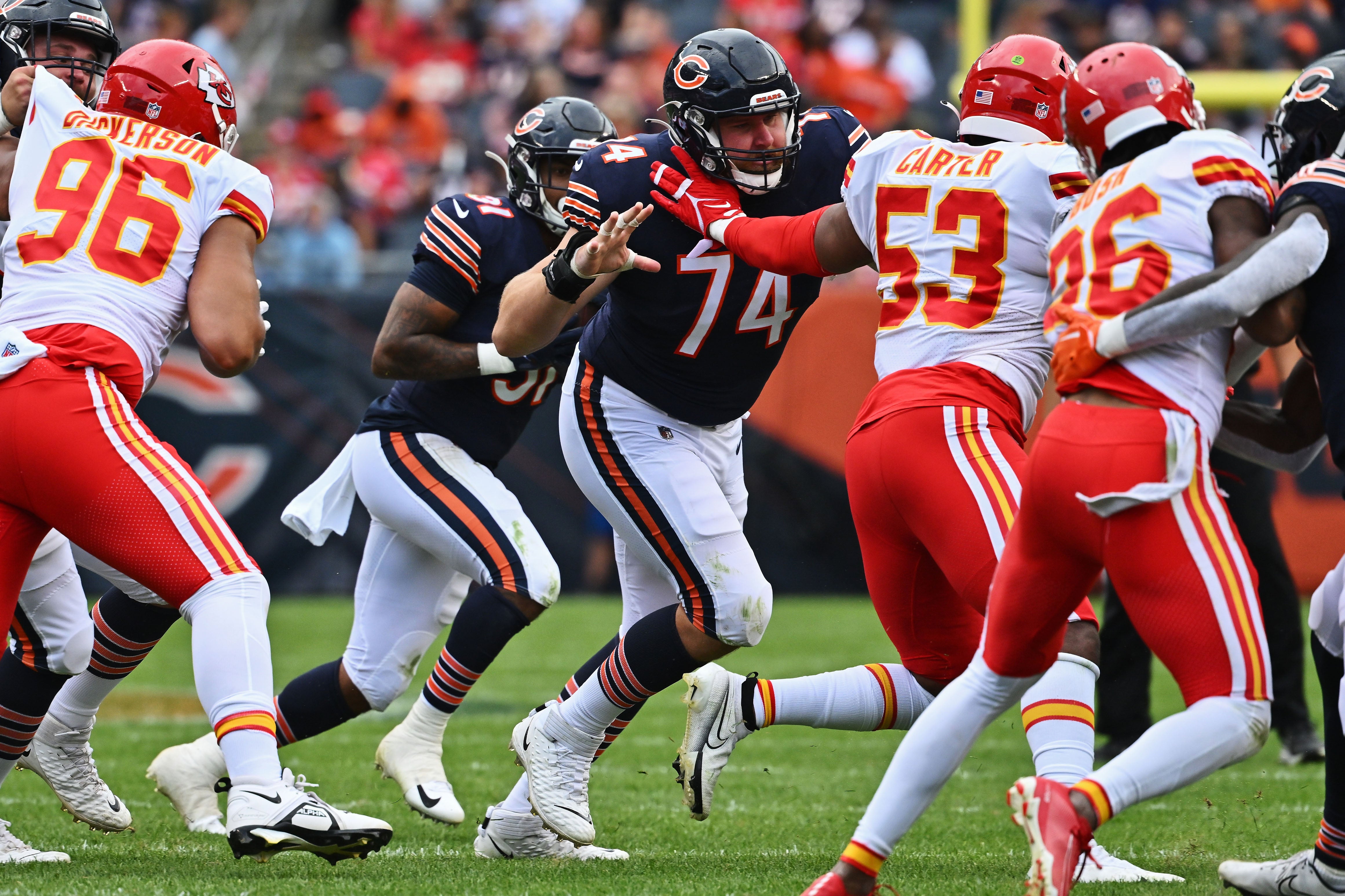 Aug 13, 2022; Chicago, Illinois, USA; Chicago Bears offensive lineman Zachary Thomas (74) leads a block against the Kansas City Chiefs at Soldier Field. Chicago defeated Kansas City 19-14.