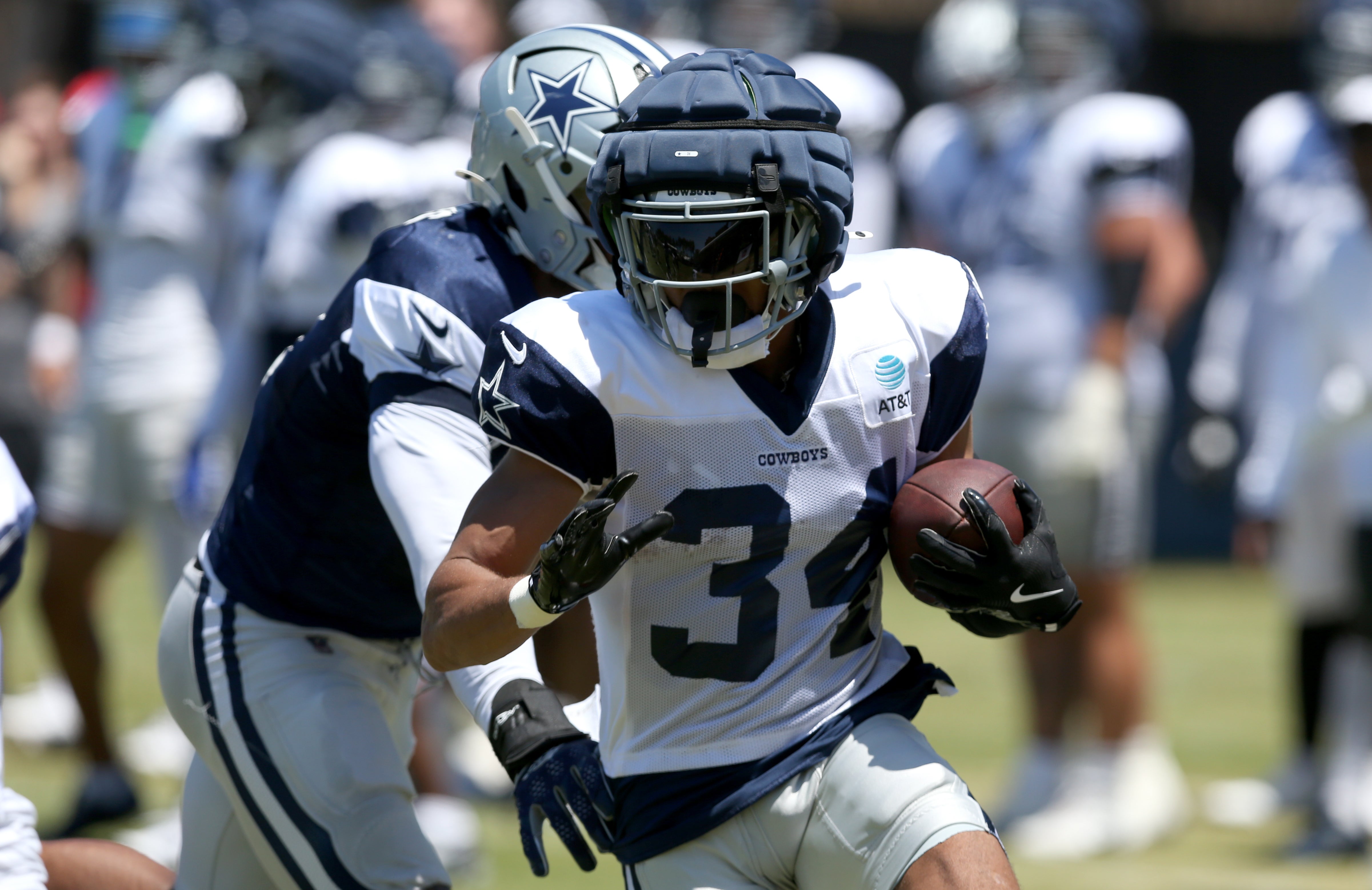 Dallas Cowboys running back Malik Davis (34) runs during training camp at the River Ridge Playing Fields in Oxnard, California.