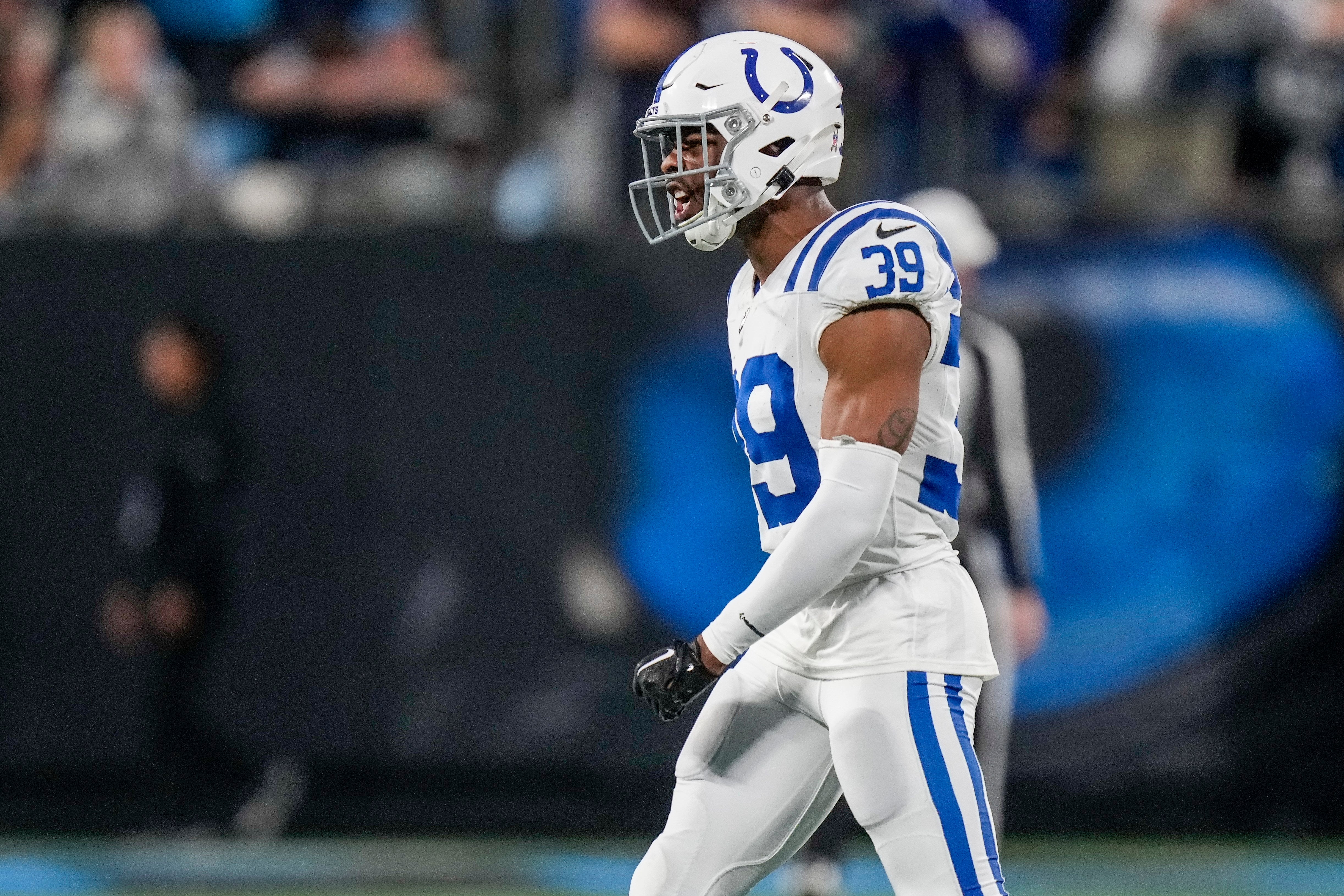 Nov 5, 2023; Charlotte, North Carolina, USA; Indianapolis Colts cornerback Darrell Baker Jr. (39) reacts to a pick six by cornerback Kenny Moore II (23) against the Carolina Panthers during the second half at Bank of America Stadium.