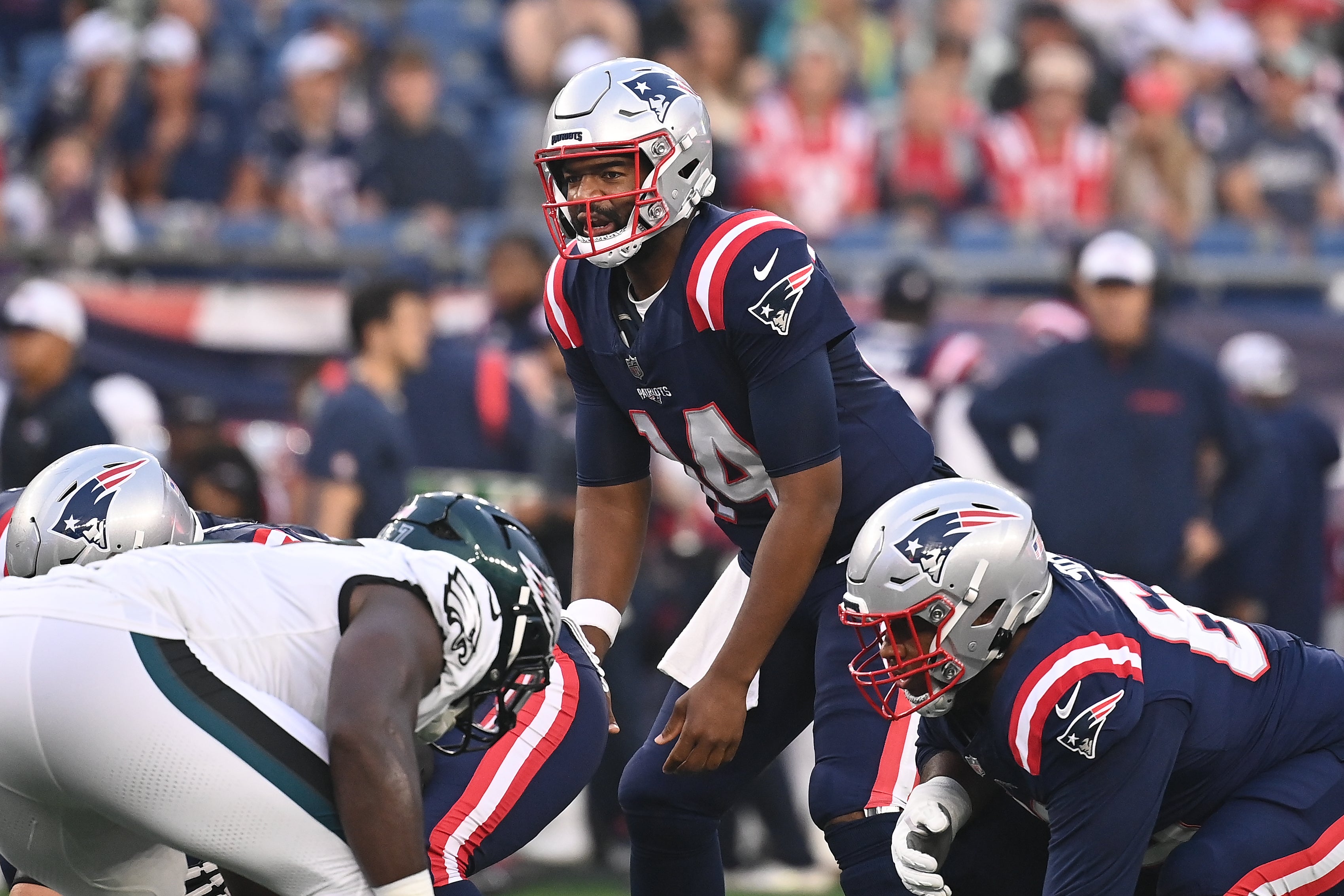 Aug 15, 2024; Foxborough, MA, USA; New England Patriots quarterback Jacoby Brissett (14) works under center during the first half against the Philadelphia Eagles at Gillette Stadium.