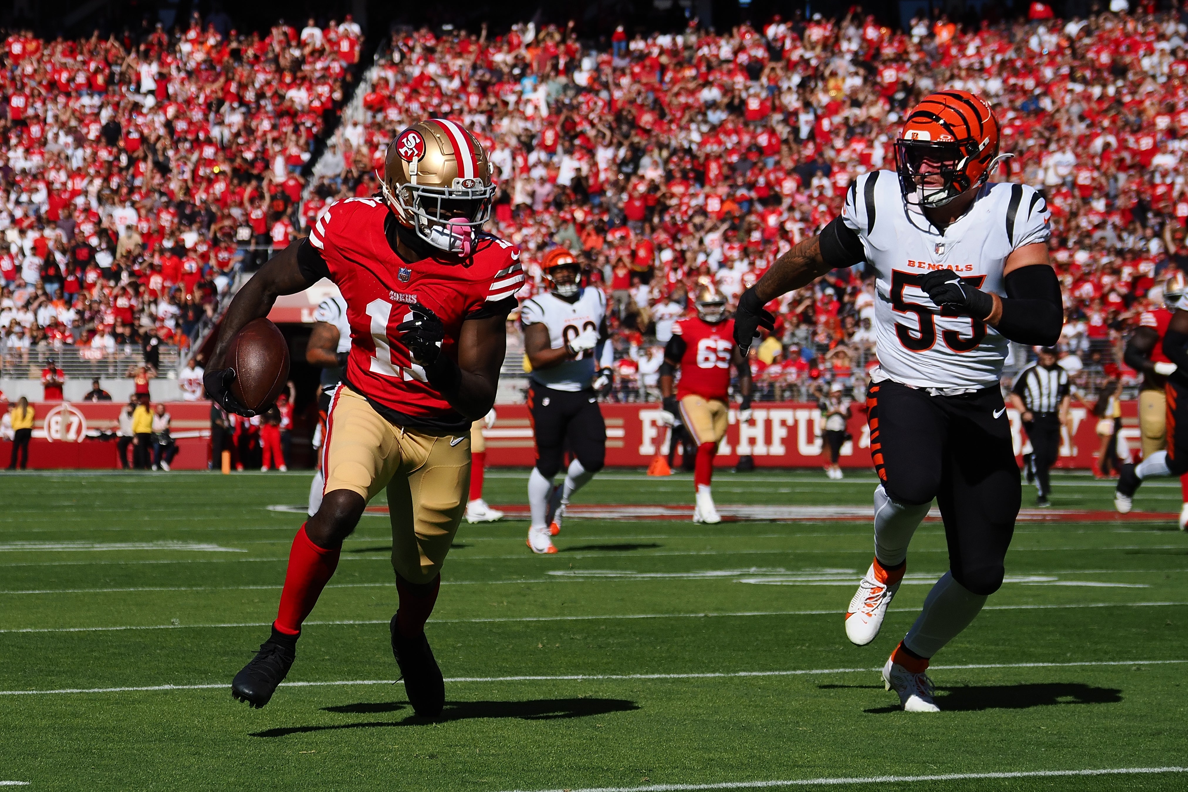 Oct 29, 2023; Santa Clara, California, USA; San Francisco 49ers wide receiver Brandon Aiyuk (11) carries the ball against Cincinnati Bengals linebacker Logan Wilson (55) during the first quarter at Levi's Stadium.