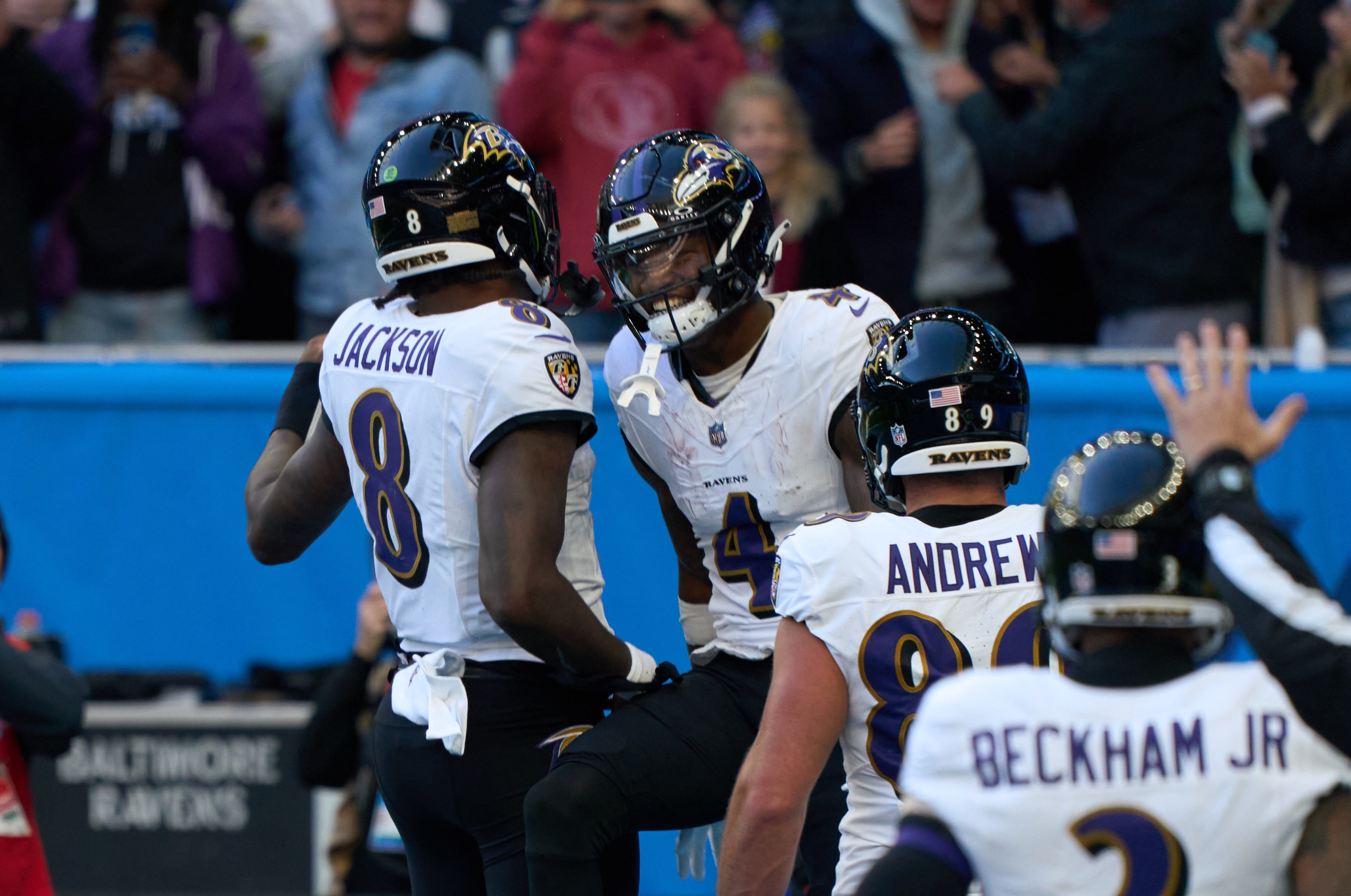 Oct 15, 2023; London, United Kingdom; Baltimore Ravens wide receiver Zay Flowers (4) celebrates with Baltimore Ravens quarterback Lamar Jackson (8) as he scores a touchdown during the first half of an NFL International Series game at Tottenham Hotspur Stadium. Mandatory Credit: Peter van den Berg-USA TODAY Sports
