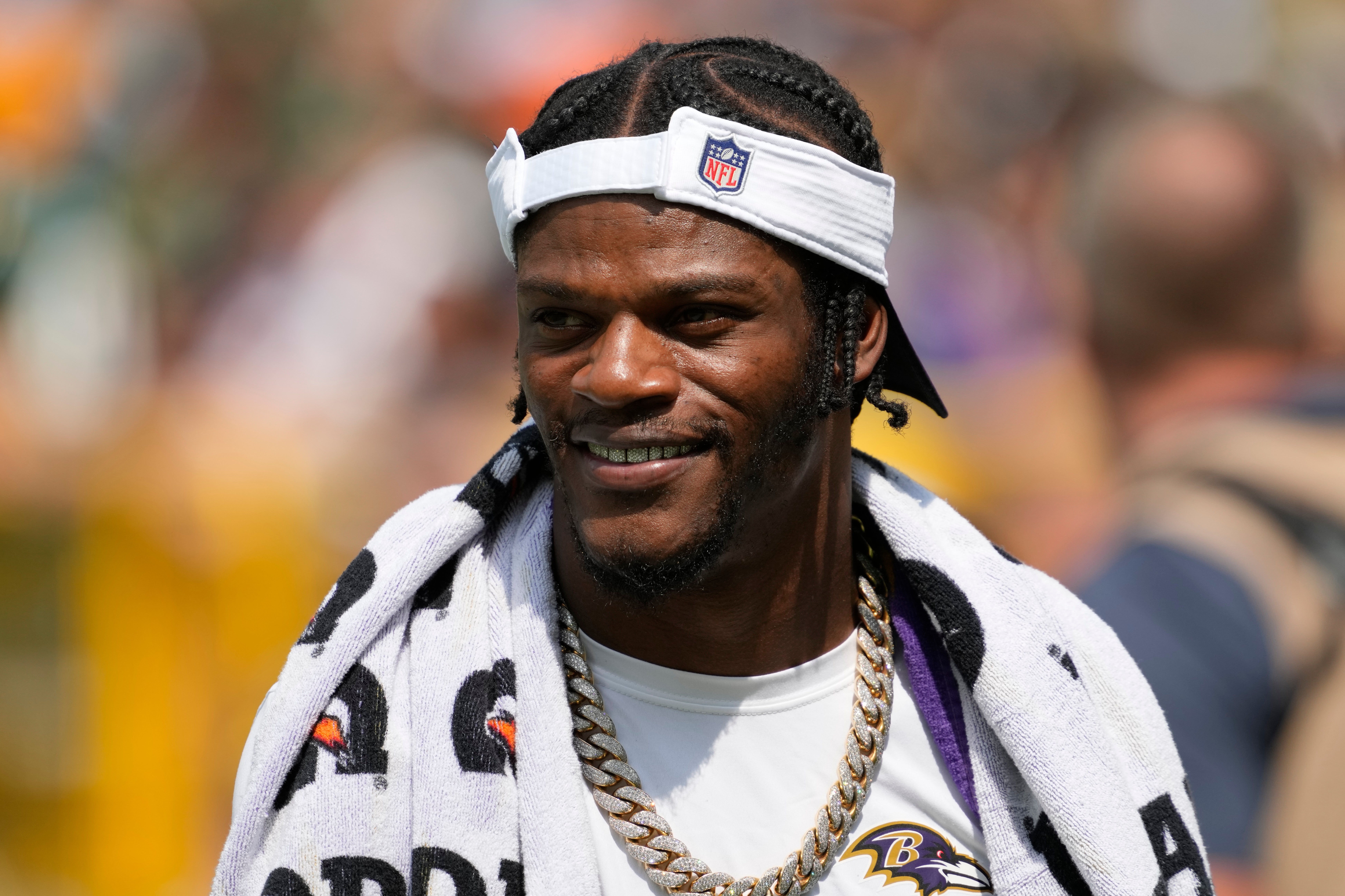 Aug 24, 2024; Green Bay, Wisconsin, USA; Baltimore Ravens quarterback Lamar Jackson walks to the locker room prior to halftime of the game against the Green Bay Packers at Lambeau Field. Mandatory Credit: Jeff Hanisch-USA TODAY Sports