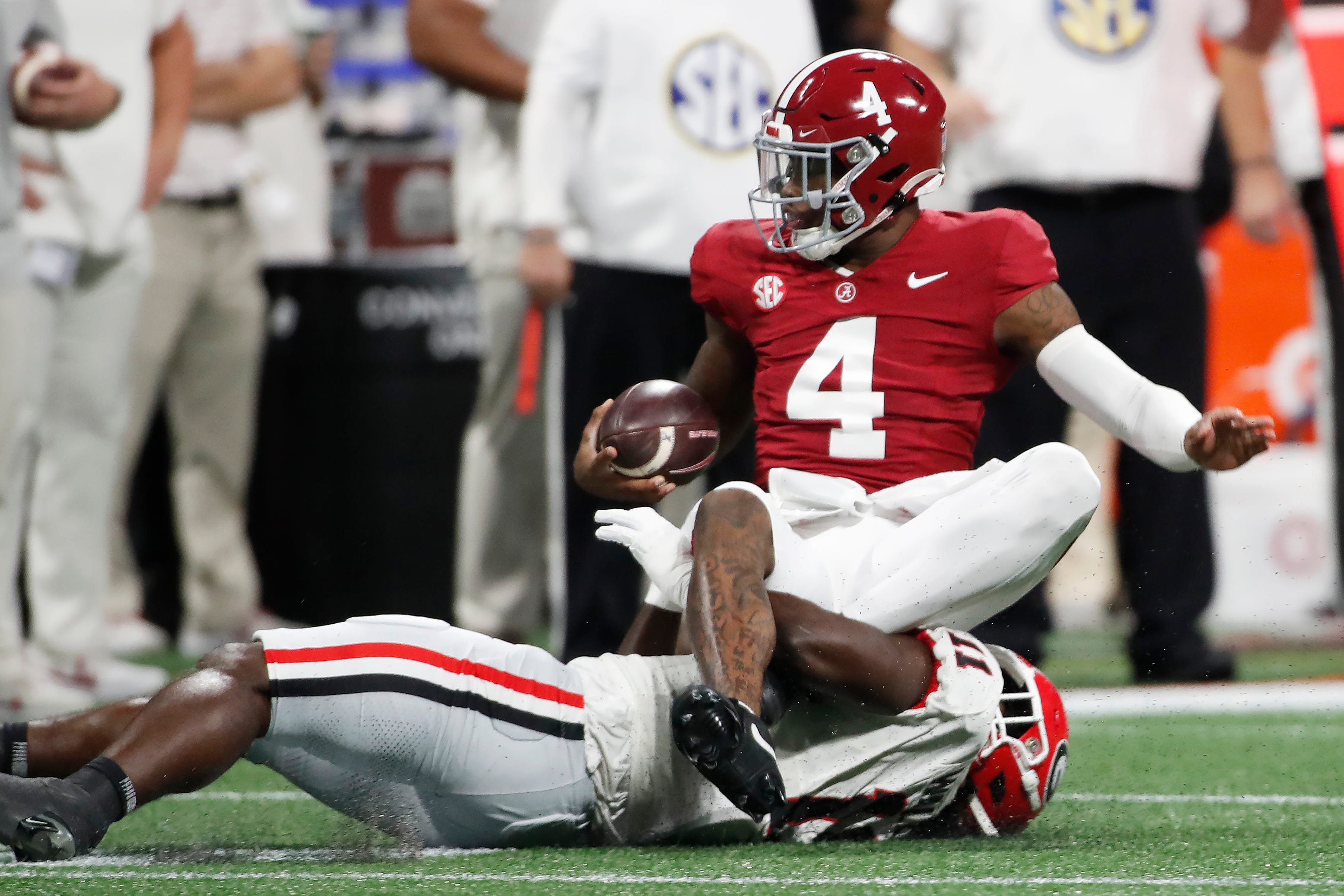 Georgia linebacker Jalon Walker (11) sacks Alabama quarterback Jalen Milroe (4) during the first half of the SEC Championship game against Alabama at Mercedes-Benz Stadium in Atlanta, on Saturday, Dec. 2, 2023.  