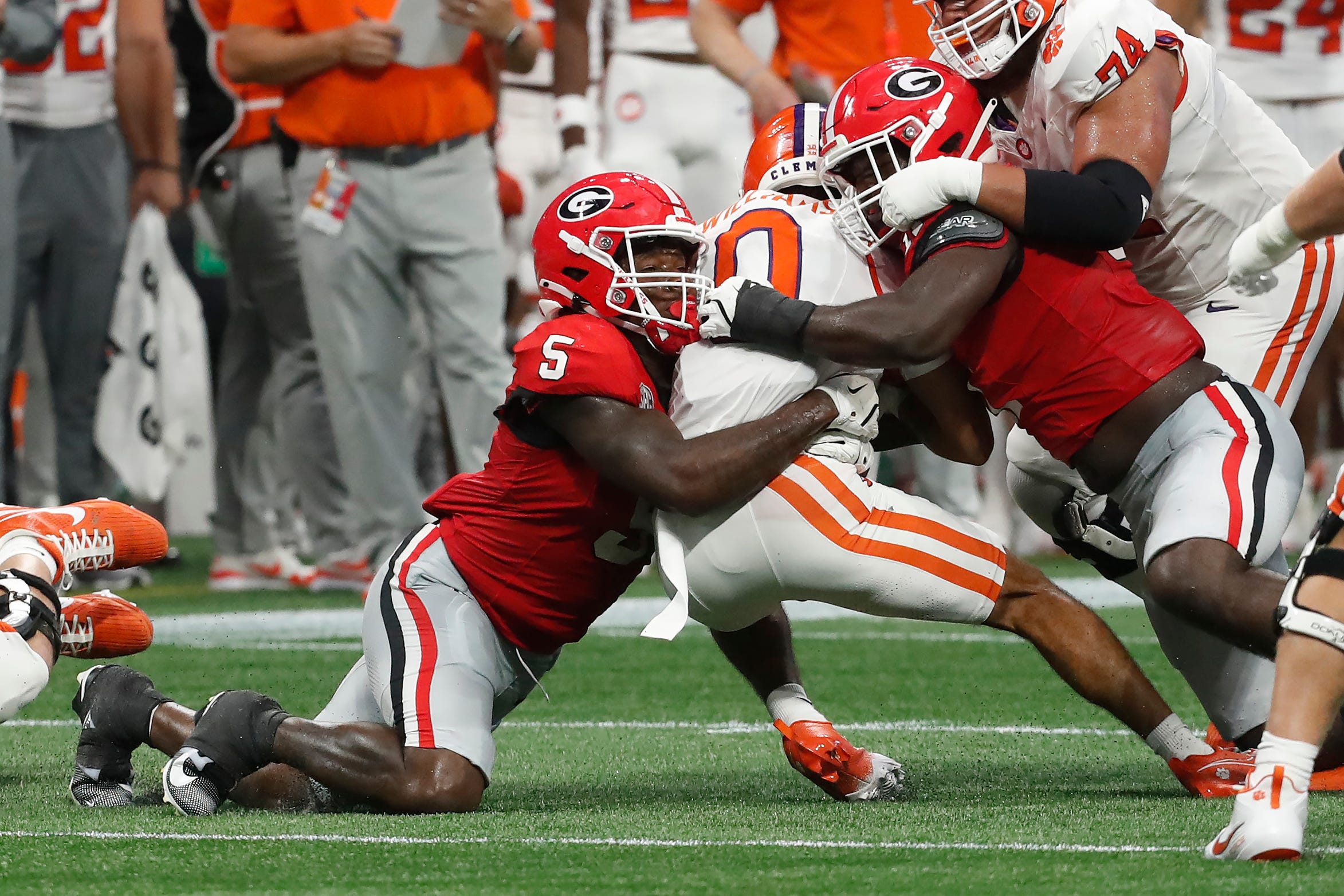 Jalon Walker and Raylen Wilson tackle Antonio Williams