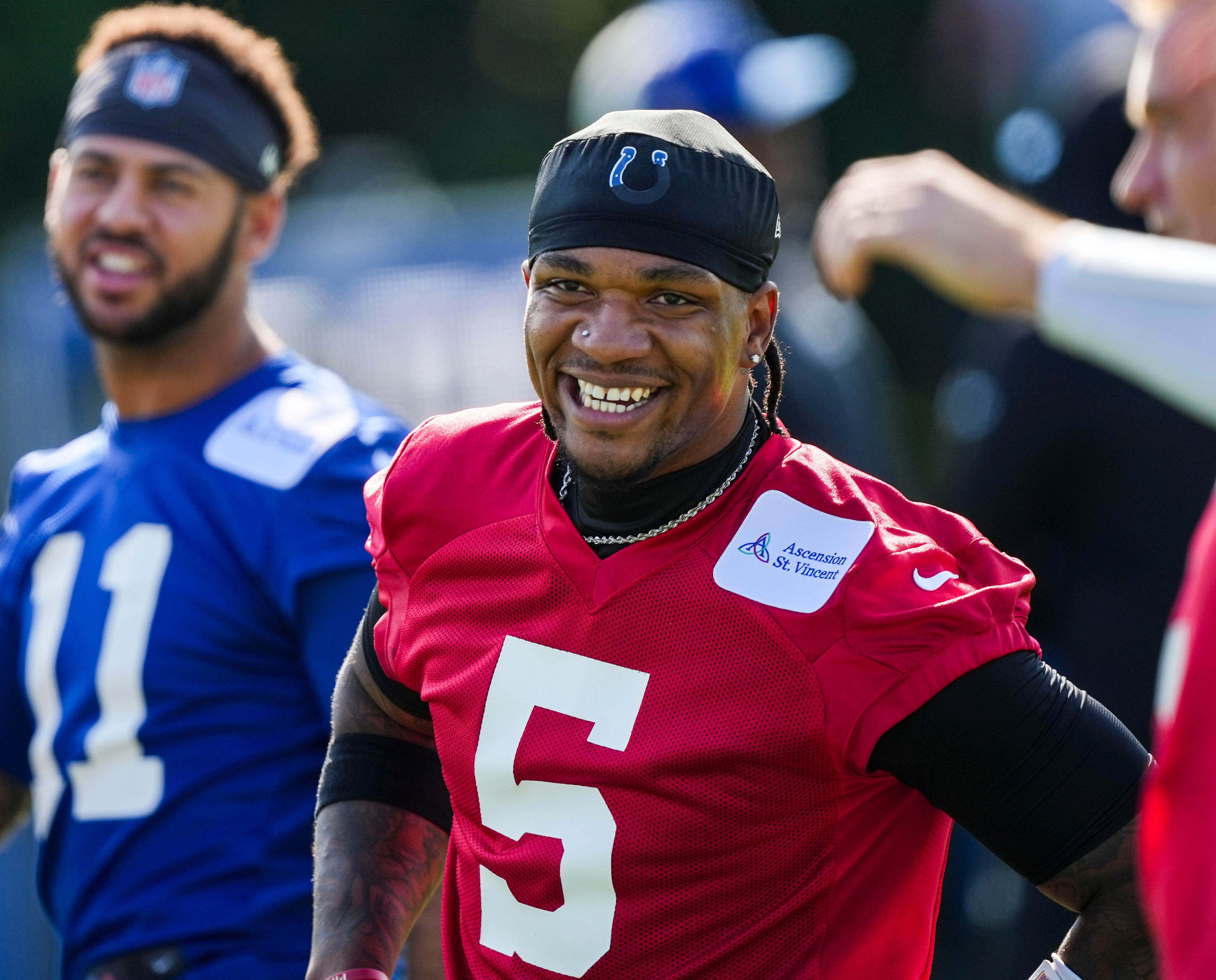 Indianapolis Colts quarterback Anthony Richardson (5) smiles while warming up Saturday, July 27, 2024, during the Indianapolis Colts’ training camp at Grand Park Sports Complex in Westfield.