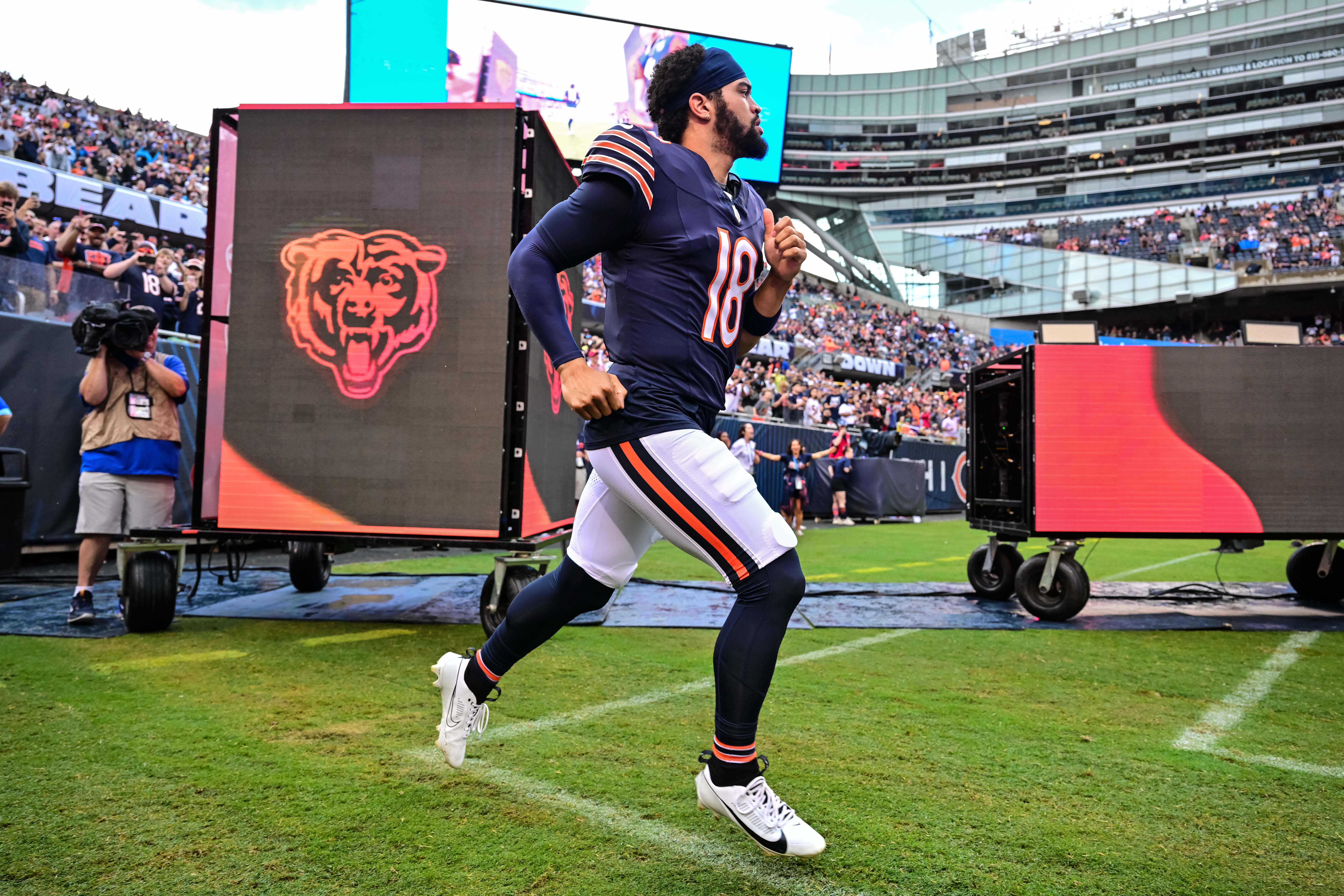 Aug 17, 2024; Chicago, Illinois, USA; Chicago Bears quarterback Caleb Williams (18) enters the field before the game against the Cincinnati Bengals at Soldier Field.