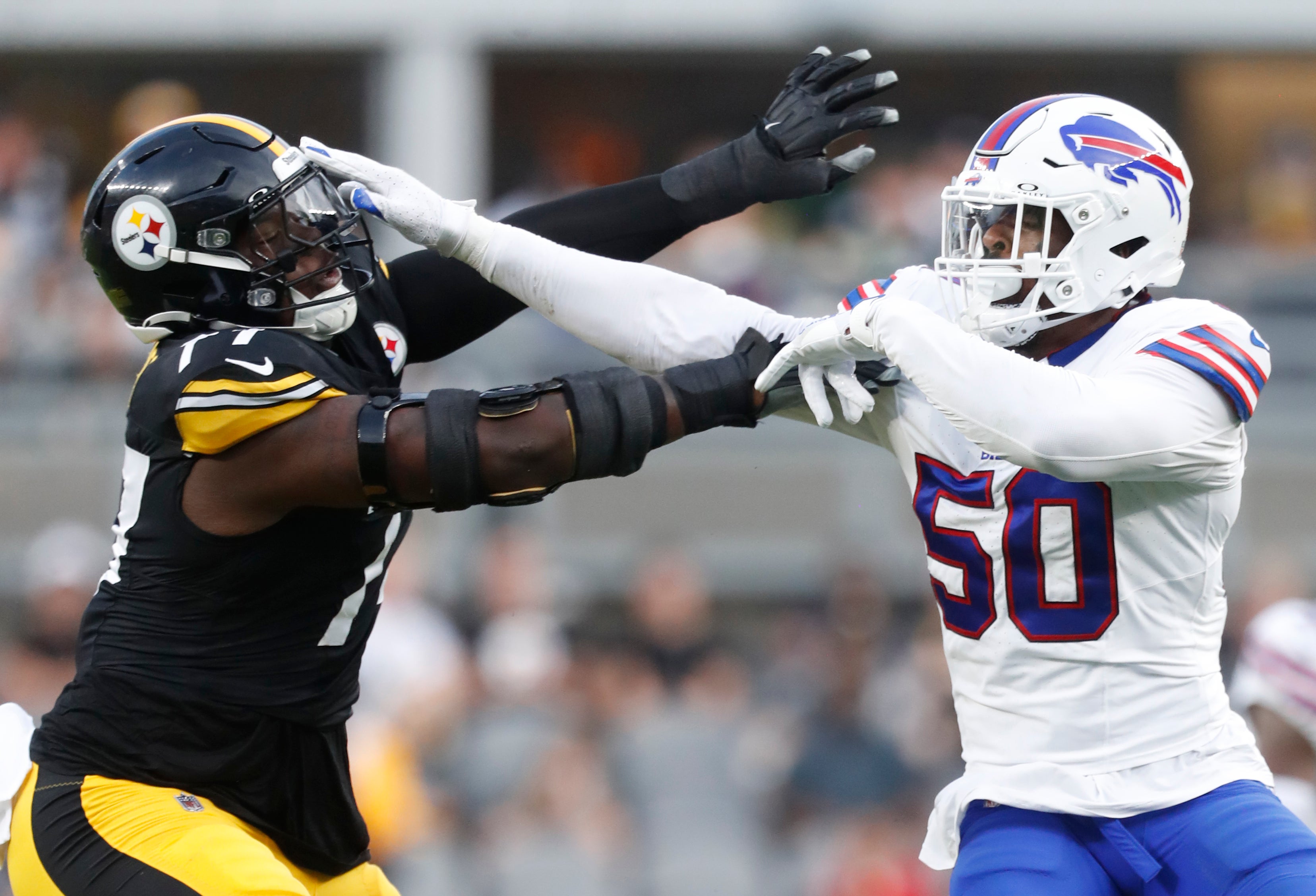 Aug 17, 2024; Pittsburgh, Pennsylvania, USA; Buffalo Bills defensive end Greg Rousseau (50) works against Pittsburgh Steelers offensive tackle Broderick Jones (77) at the line of scrimmage during the first quarter at Acrisure Stadium. Mandatory Credit: Charles LeClaire-USA TODAY Sports
