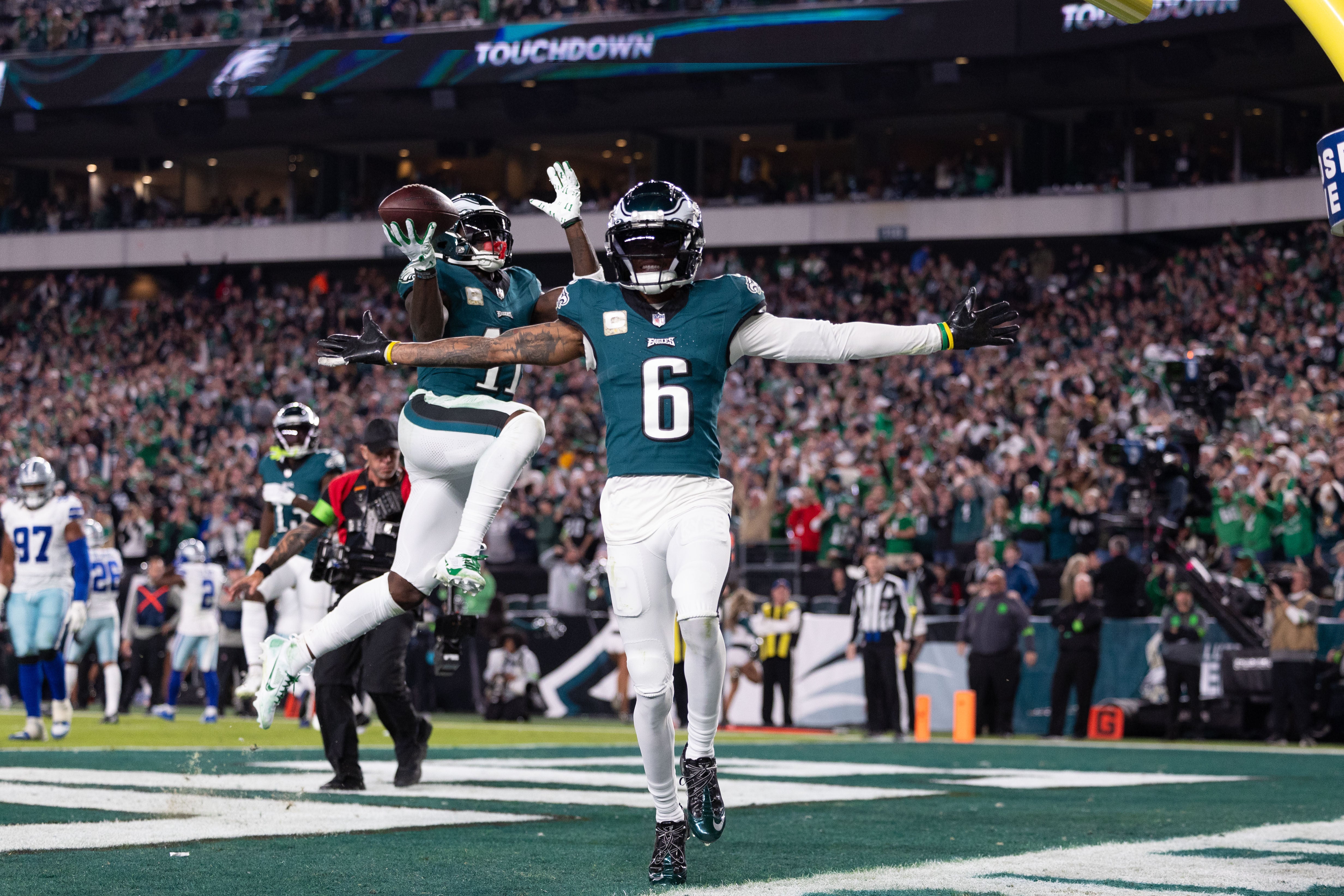 Eagles wide receiver A.J. Brown (11) celebrates his touchdown behind wide receiver DeVonta Smith (6)