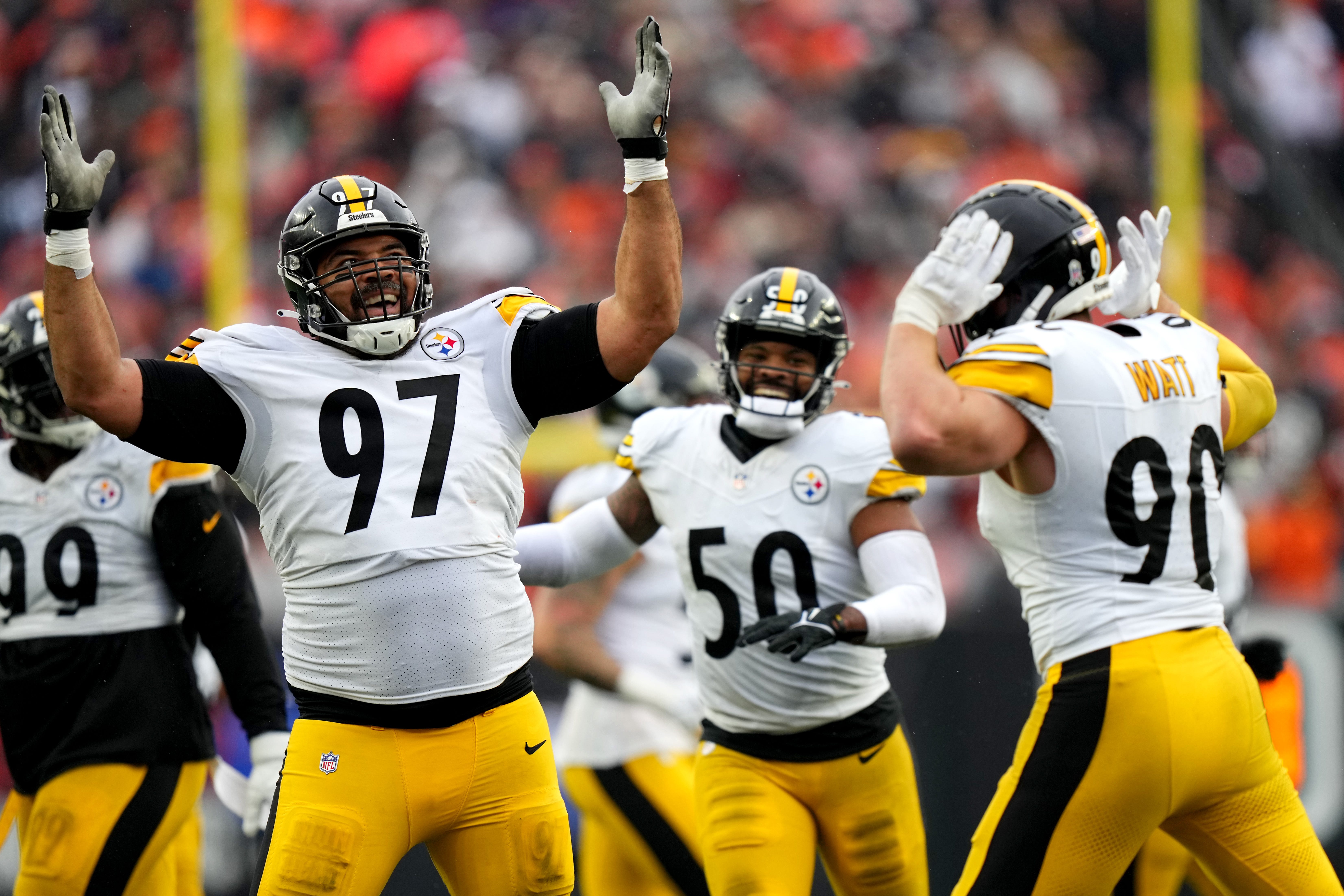 Pittsburgh Steelers defensive tackle Cameron Heyward (97) and Pittsburgh Steelers linebacker T.J. Watt (90) celebrate a sack of Cincinnati Bengals quarterback Jake Browning (6) in the fourth quarter of a Week 12 NFL football game between the Pittsburgh Steelers and the Cincinnati Bengals, Sunday, Nov. 26, 2023, at Paycor Stadium.