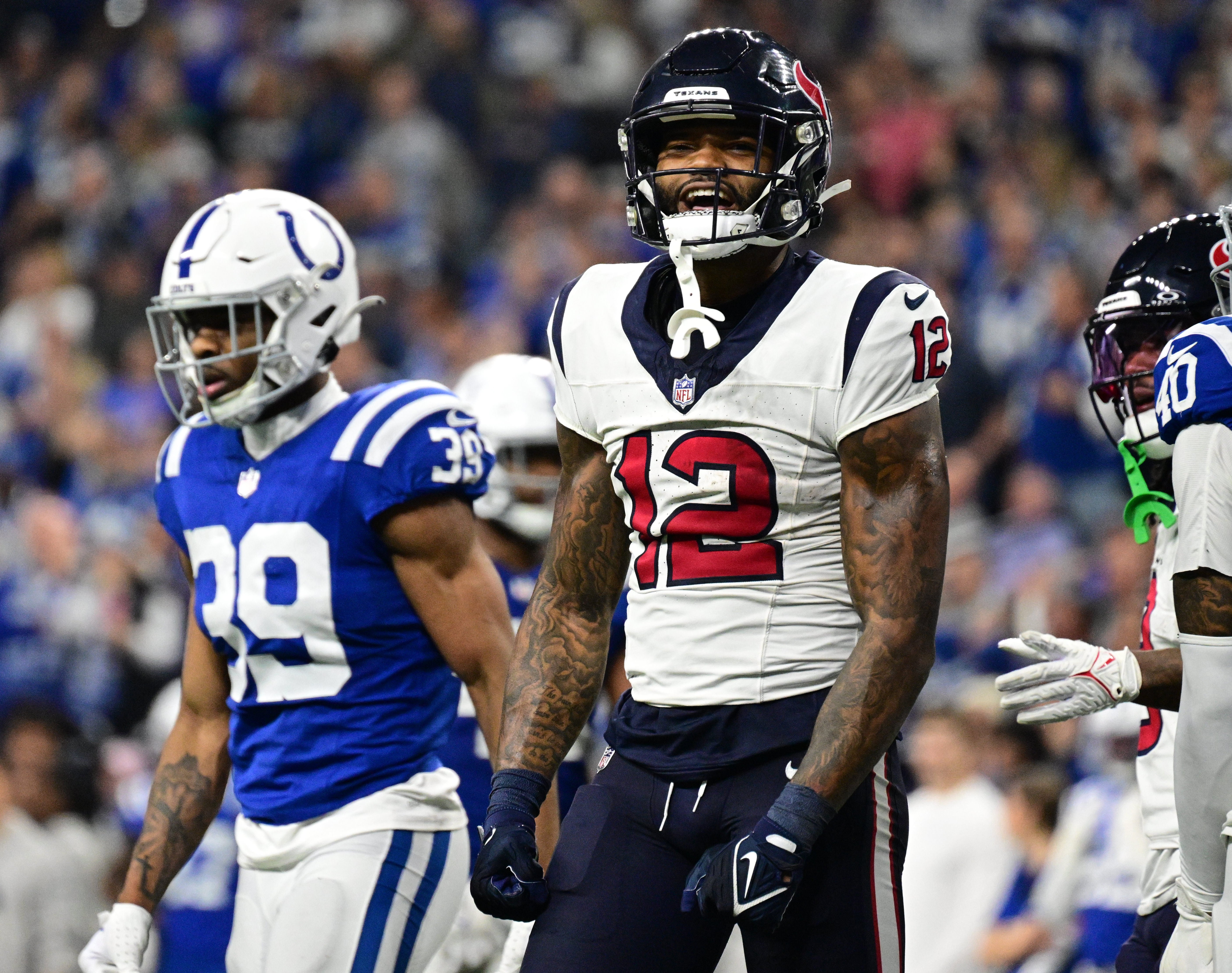 Jan 6, 2024; Indianapolis, Indiana, USA; Houston Texans wide receiver Nico Collins (12) reacts after making a first down against the Indianapolis Colts during the second half at Lucas Oil Stadium.