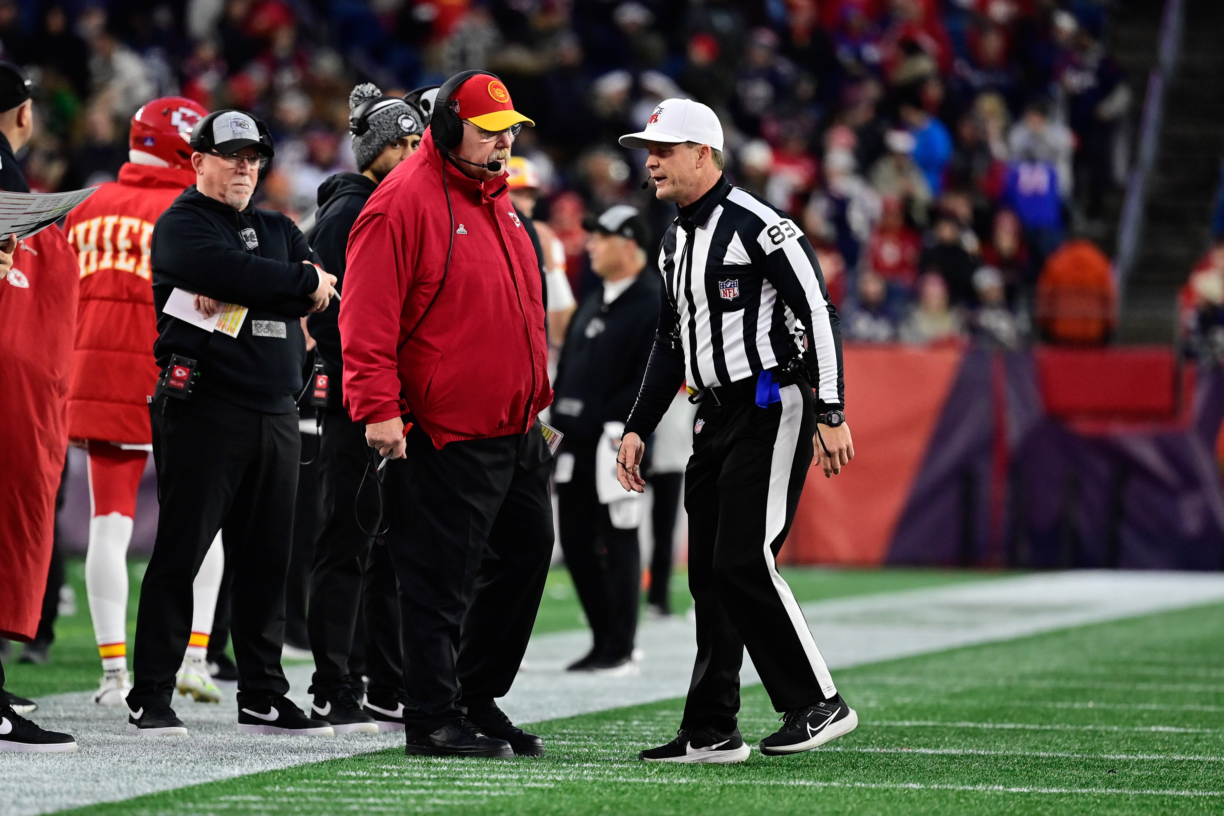 Chiefs head coach Andy Reid speaks to referee Shawn Hochuli (83) during the second half against the New England Patriots at Gillette Stadium.