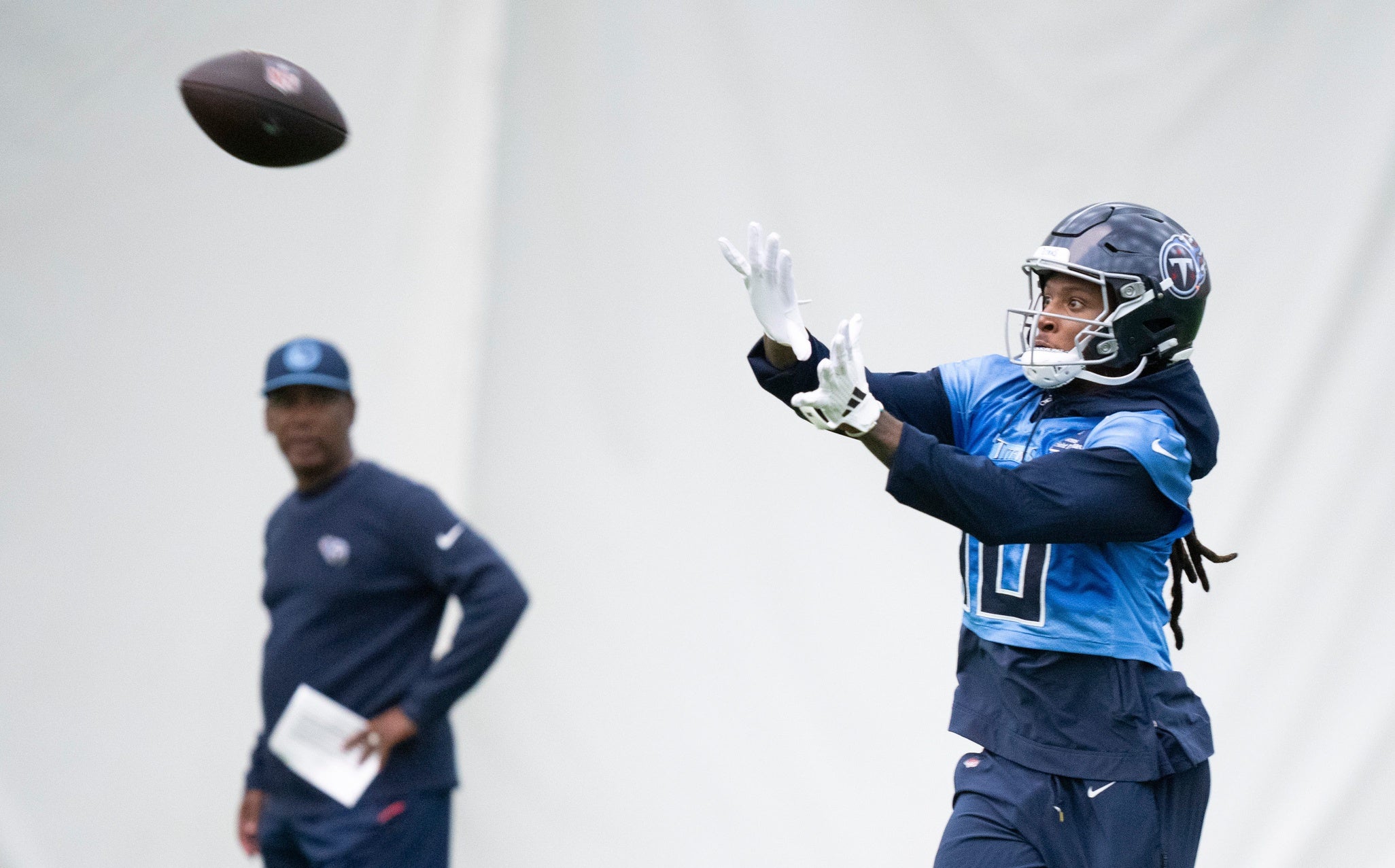Wide receiver DeAndre Hopkins (10) watches a pass into his hands during the Tennessee Titans mandatory mini-camp at Ascension Saint Thomas Sports Park in Nashville, Tenn., Tuesday, June 4, 2024.