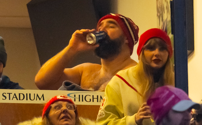 Jan 21, 2024; Orchard Park, New York, USA; Taylor Swift watches the game as Jason Kelce drinks a beer during the Kansas City Chiefs game in the 2024 AFC divisional round game between against the Buffalo Bills at Highmark Stadium.