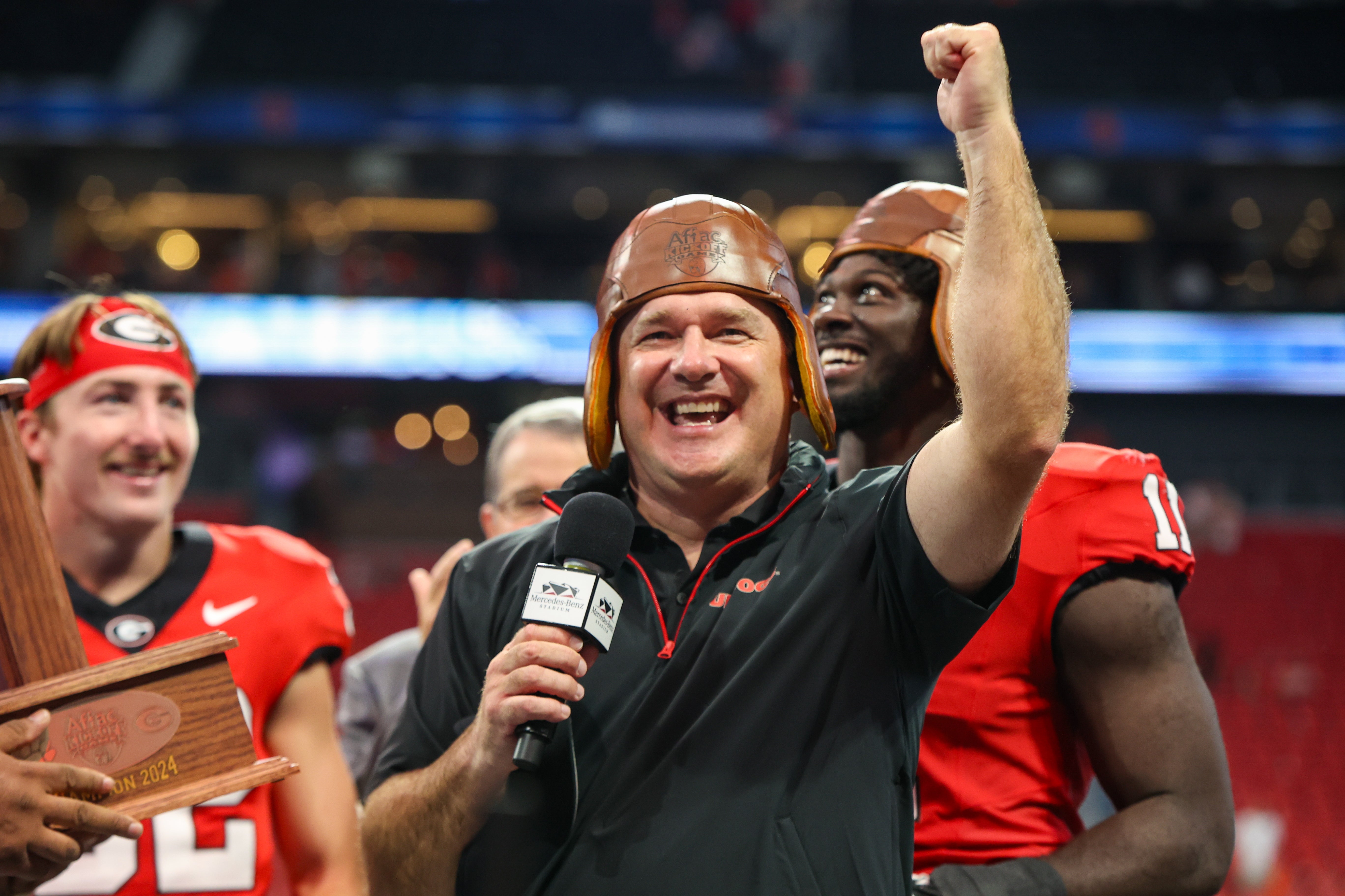 Kirby Smart and Cash Jones celebrate victory over Clemson.