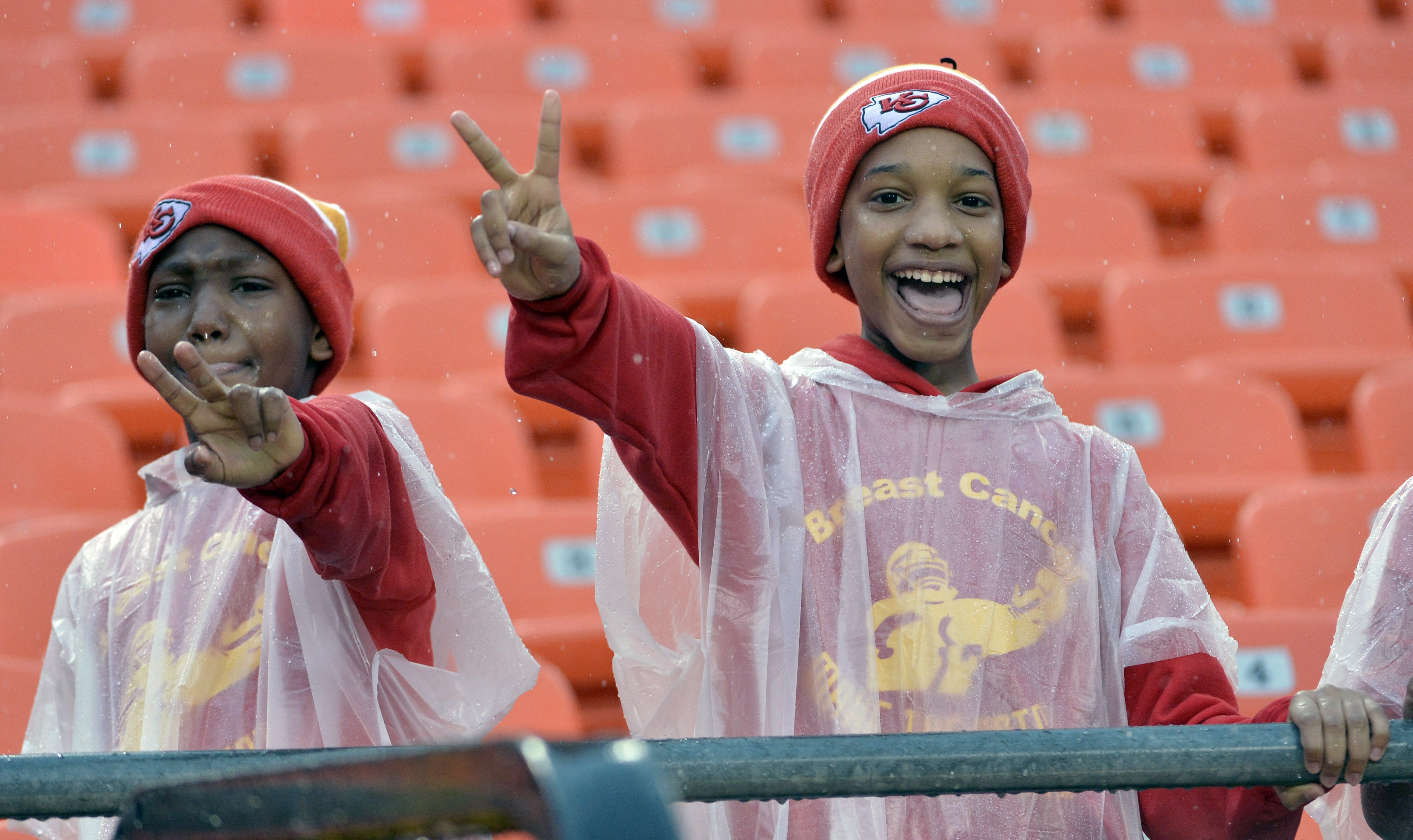 Dec 13, 2015; Kansas City, MO, USA; Fans watch team warmups in the rain before the game between the Kansas City Chiefs and San Diego Chargers at Arrowhead Stadium.
