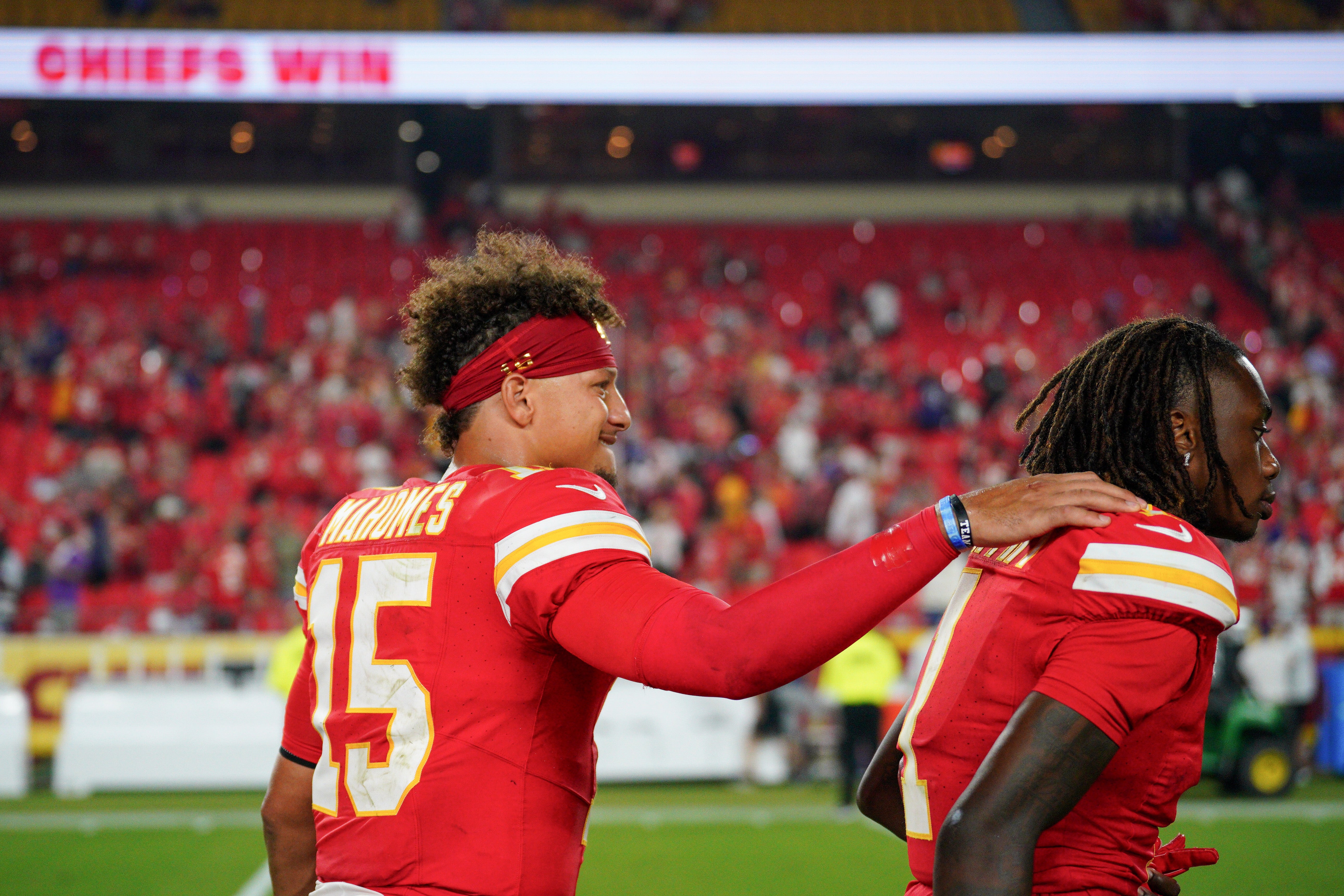 Sep 5, 2024; Kansas City, Missouri, USA; Kansas City Chiefs quarterback Patrick Mahomes (15) celebrates with wide receiver Xavier Worthy (1) after the win over the Baltimore Ravens at GEHA Field at Arrowhead Stadium.