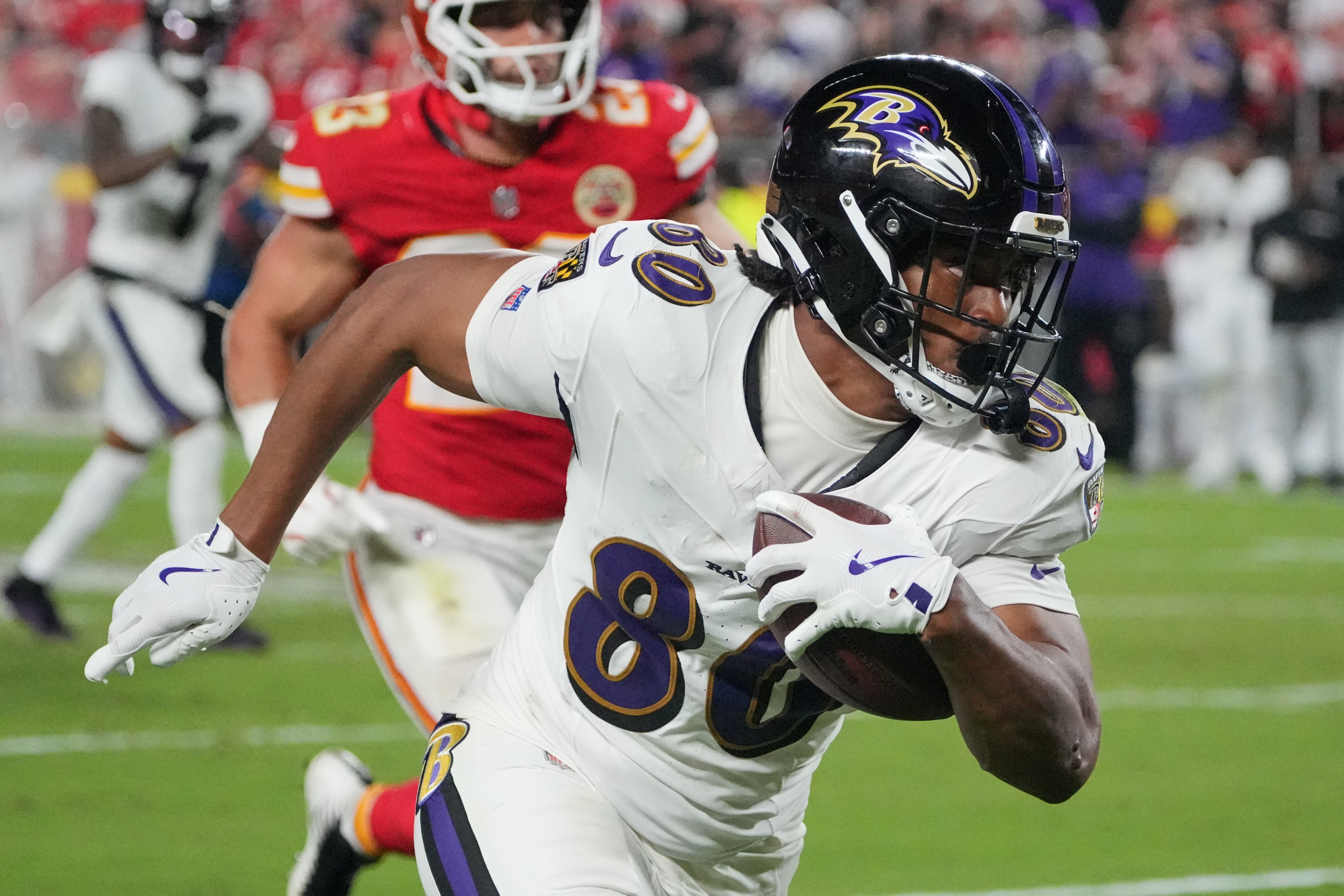 Sep 5, 2024; Kansas City, Missouri, USA; Baltimore Ravens tight end Isaiah Likely (80) runs the ball against the Kansas City Chiefs during the second half at GEHA Field at Arrowhead Stadium.