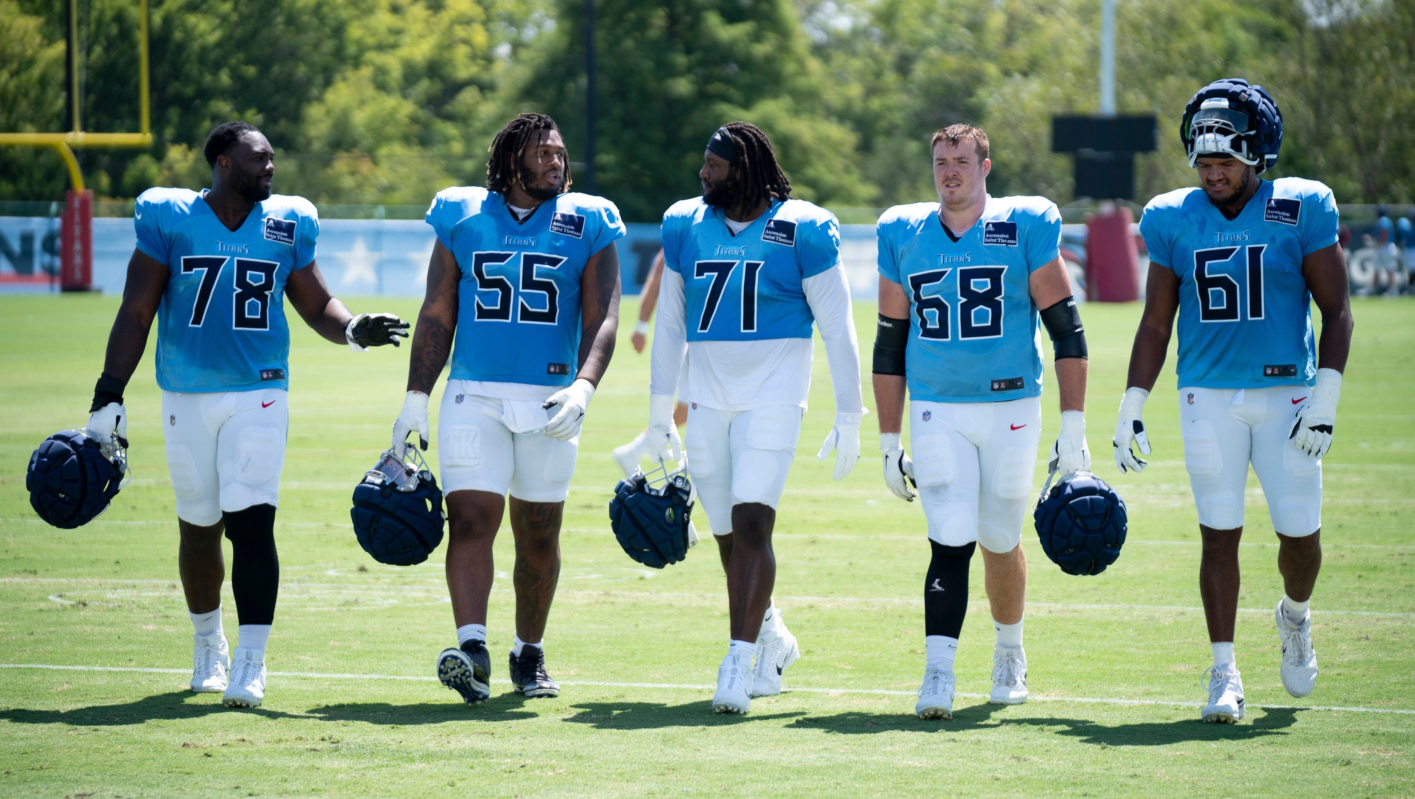 Tennessee Titans linemen head in after practice during training camp at Ascension Saint Thomas Sports Park in Nashville, Tenn., Wednesday, Aug. 21 2024.
