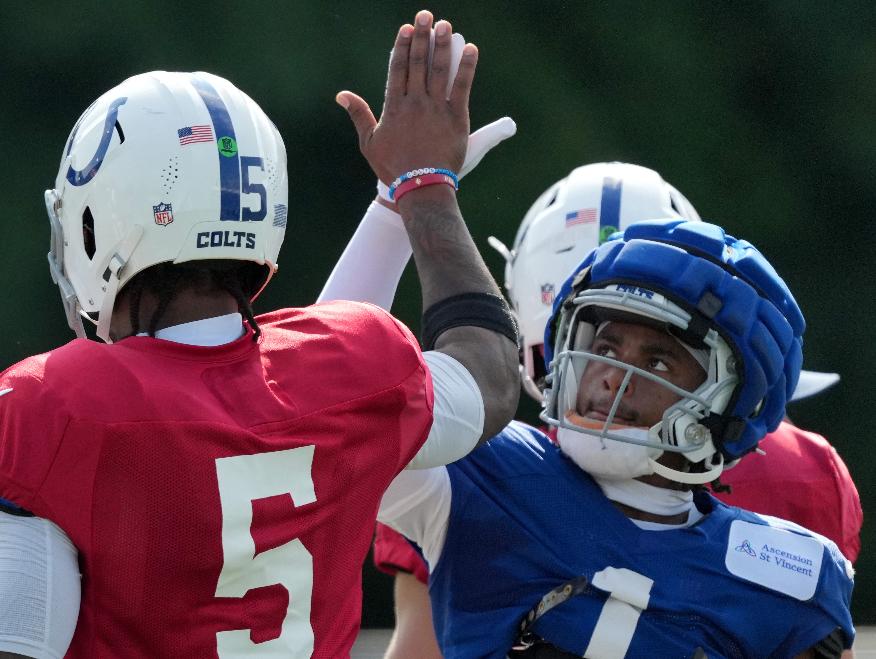 Indianapolis Colts quarterback Anthony Richardson (5) high fives wide receiver Josh Downs (1) during training camp Tuesday, July 30, 2024, at Grand Park Sports Complex in Westfield.