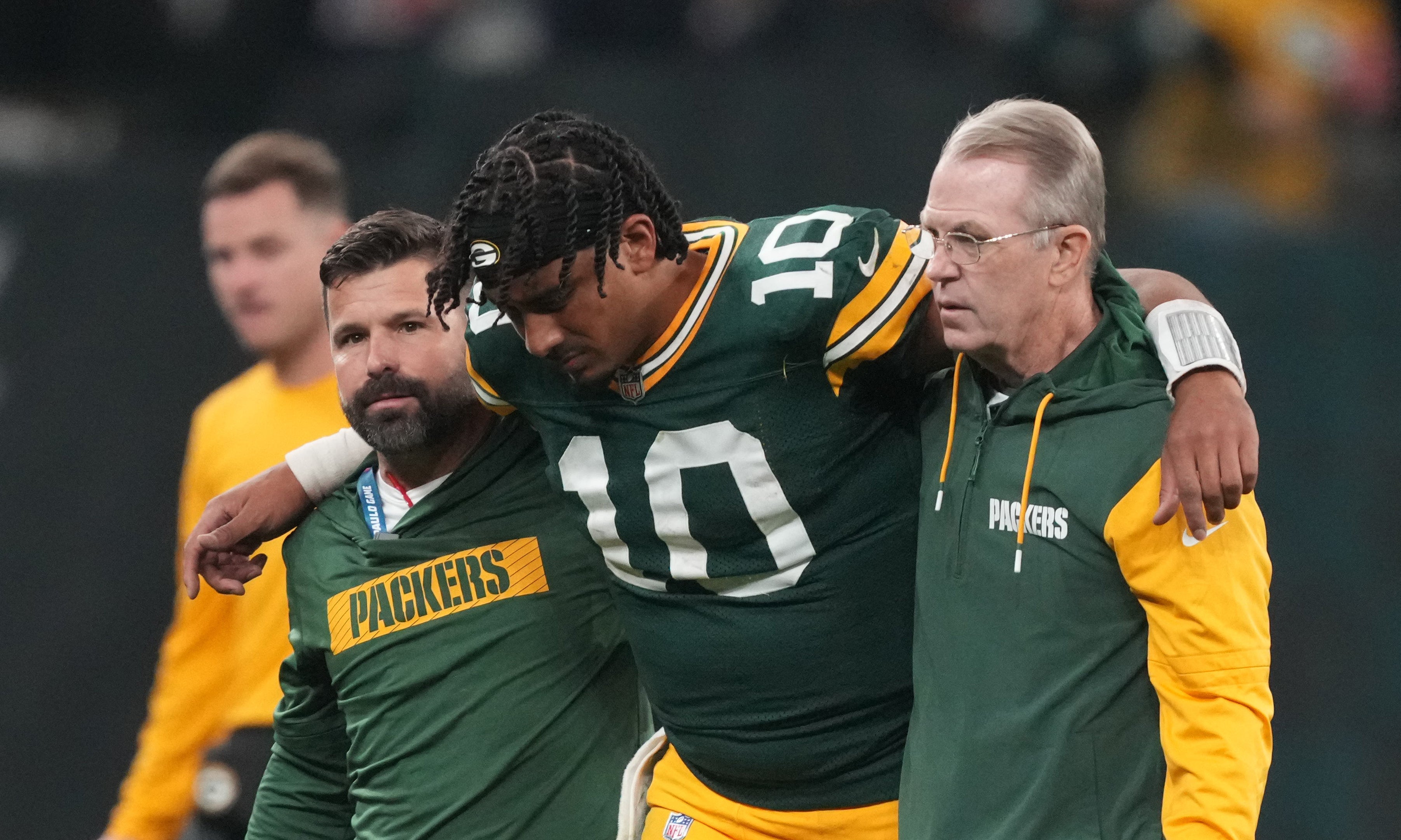 Green Bay Packers quarterback Jordan Love (10) is assisted off the field after an injury during the second half against the Philadelphia Eagles at Neo Quimica Arena. Kirby Lee-Imagn Images 