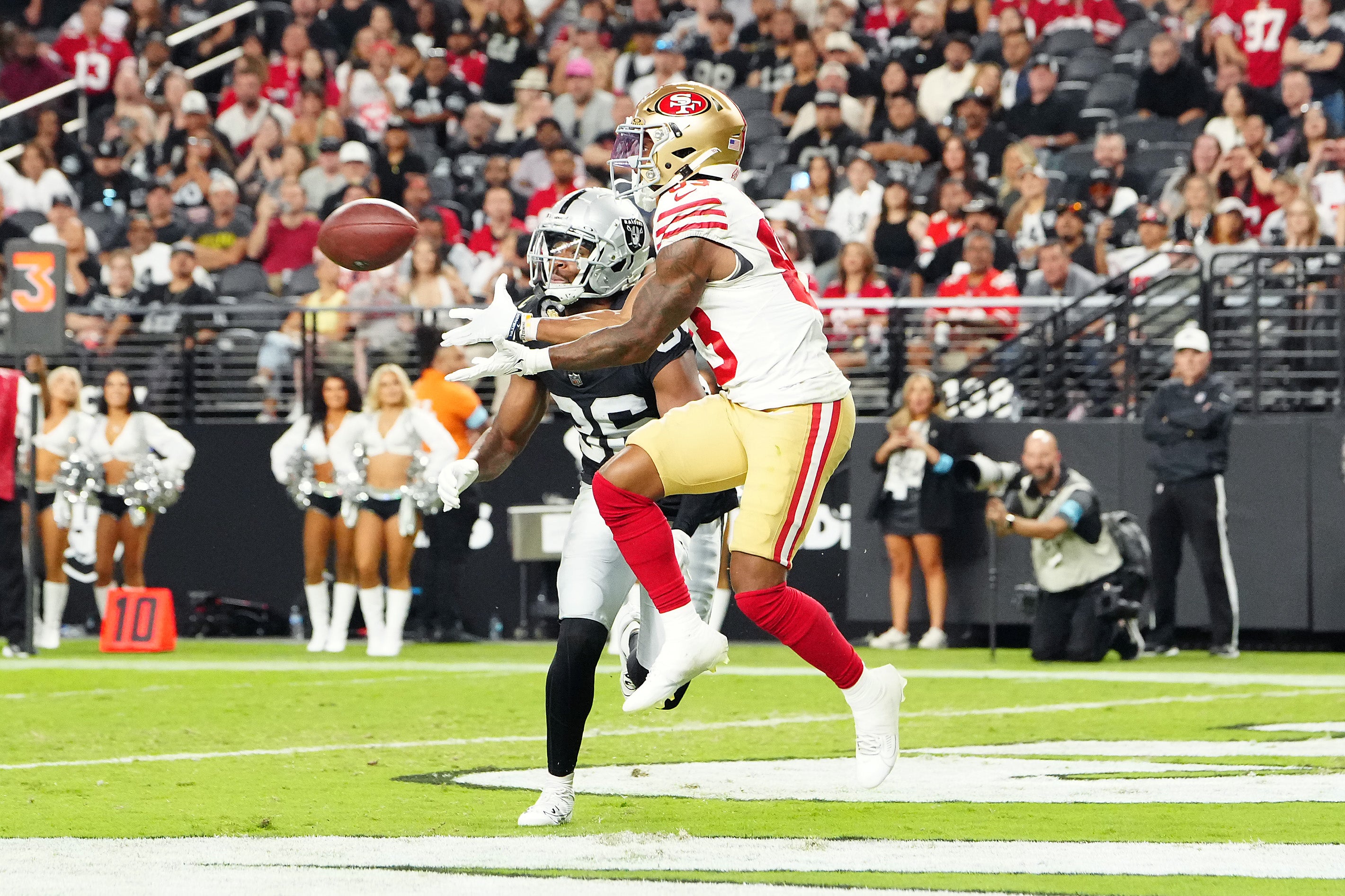 Aug 23, 2024; Paradise, Nevada, USA; San Francisco 49ers wide receiver Jacob Cowing (83) makes a touchdown catch against Las Vegas Raiders cornerback Rayshad Williams (36) during the third quarter at Allegiant Stadium.
