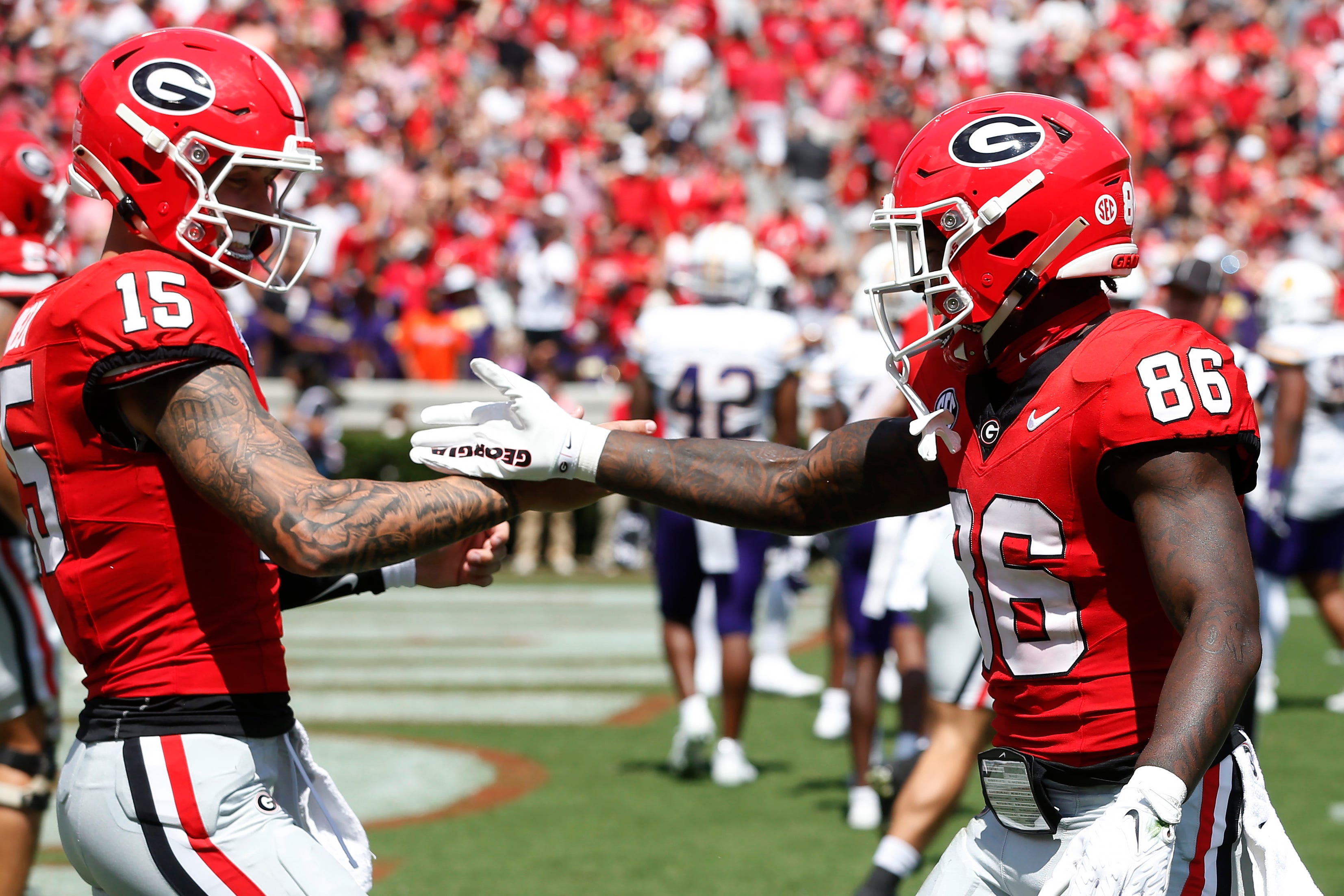 Carson Beck and Dillon Bell celebrate a touchdown together