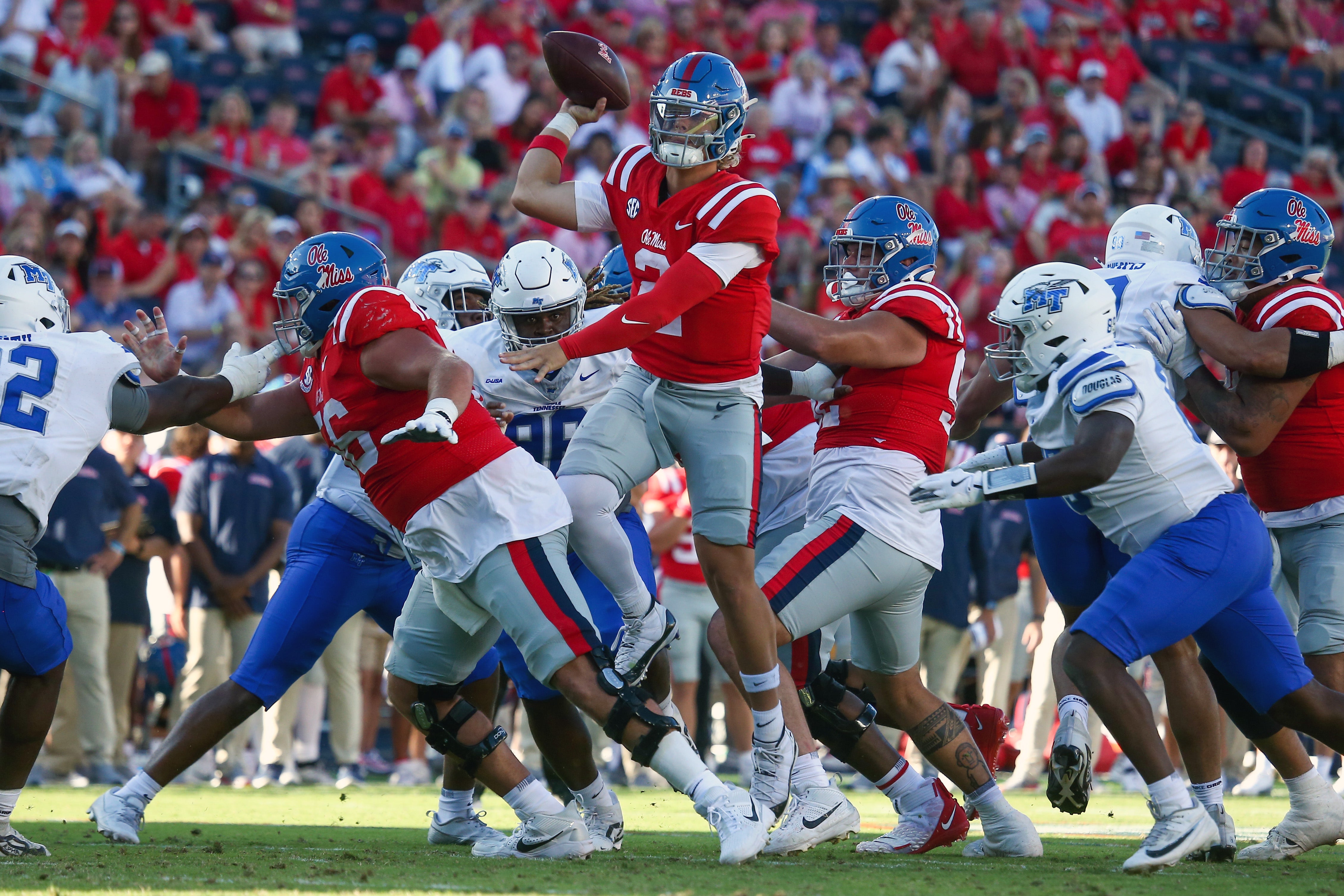 Jaxson Dart makes a leaping pass against MTSU