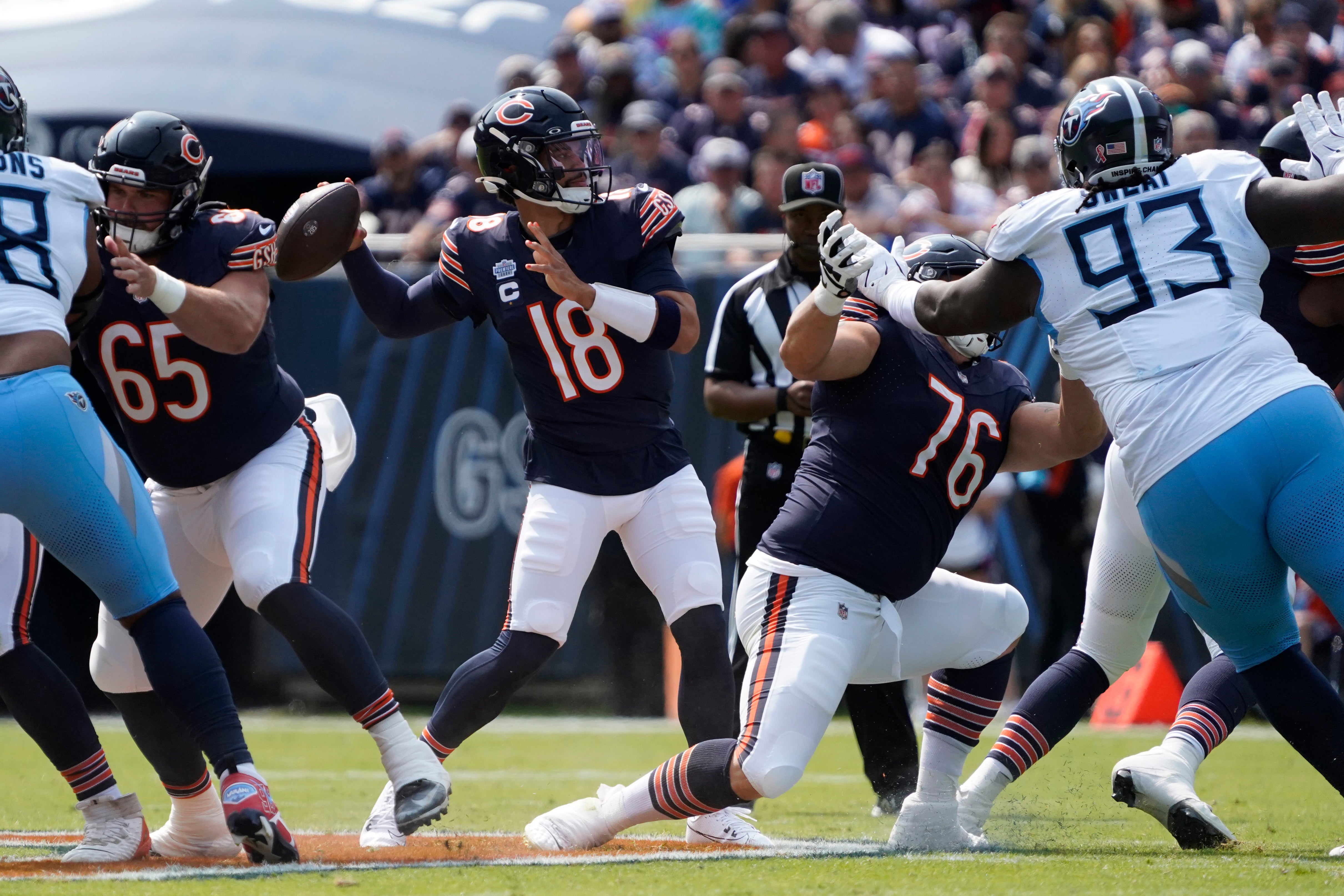 Sep 8, 2024; Chicago, Illinois, USA; Chicago Bears quarterback Caleb Williams (18) passes against the Tennessee Titans during the first half at Soldier Field.