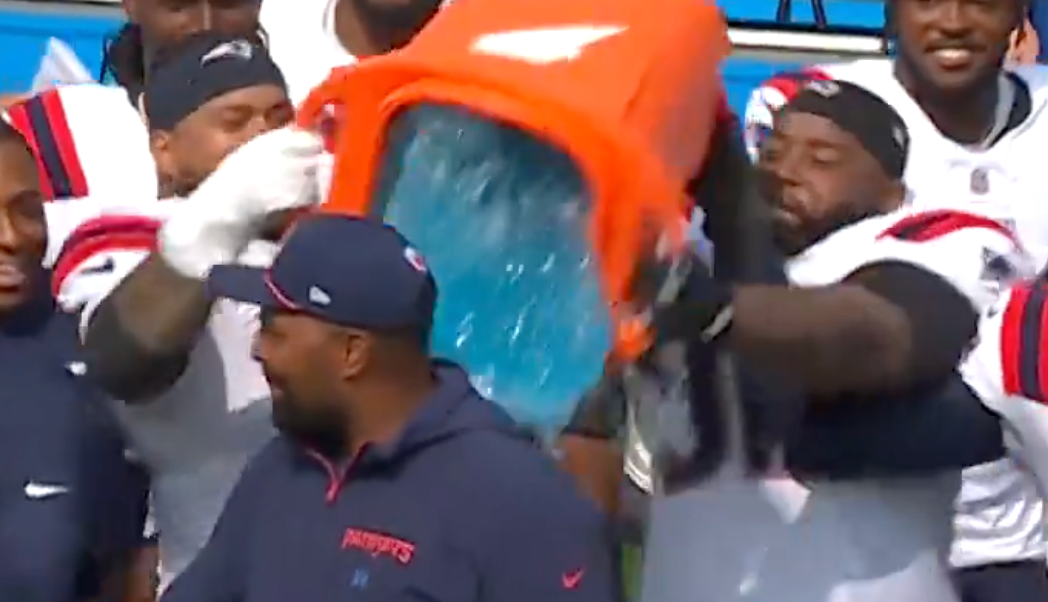 Davon Godchaux and Daniel Ekuale pour gatorade on Jerod Mayo after he won his first regular season NFL game as head coach