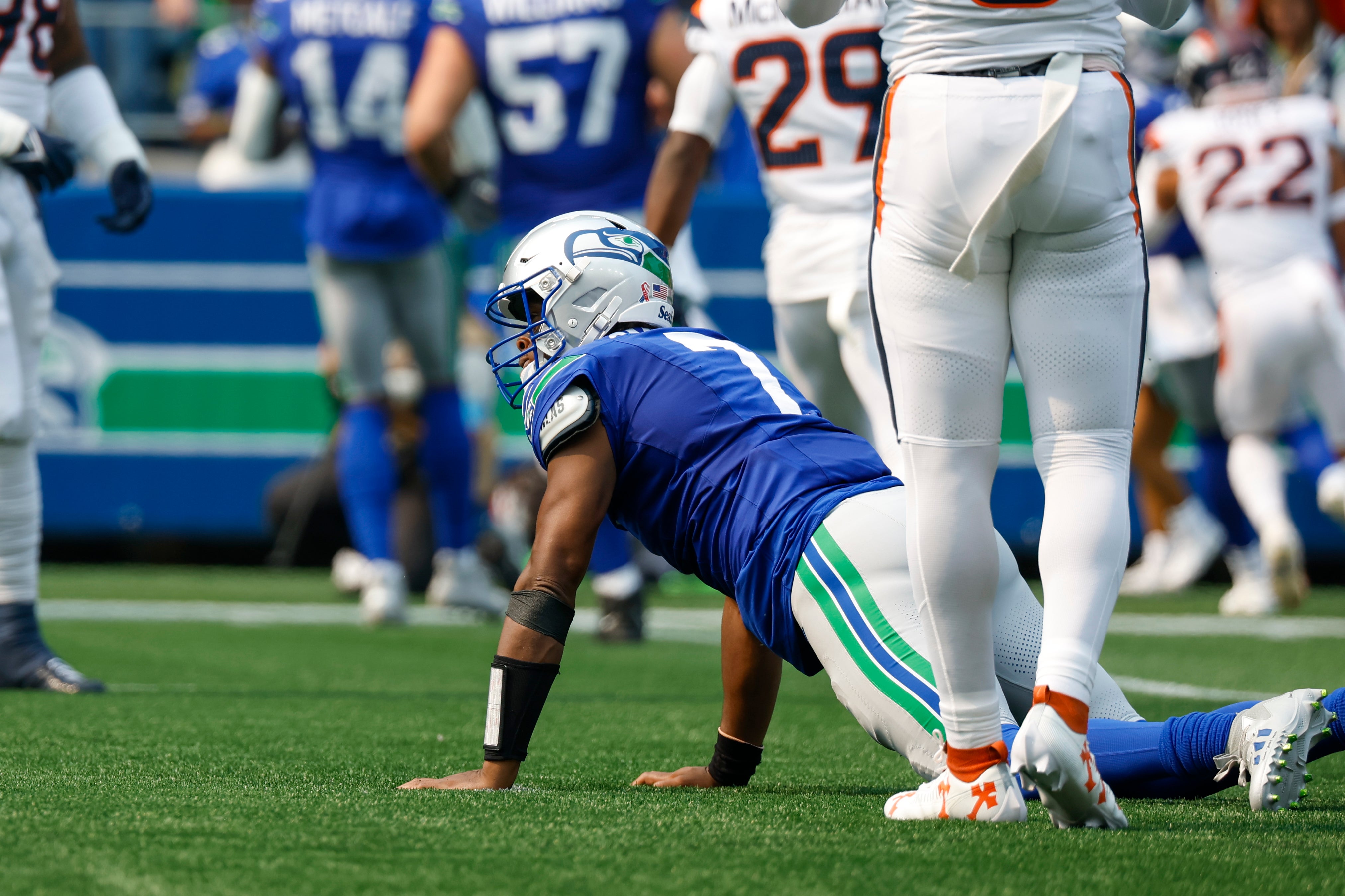 Sep 8, 2024; Seattle, Washington, USA; Seattle Seahawks quarterback Geno Smith (7) reacts after throwing an interception against the Denver Broncos during the first quarter at Lumen Field.