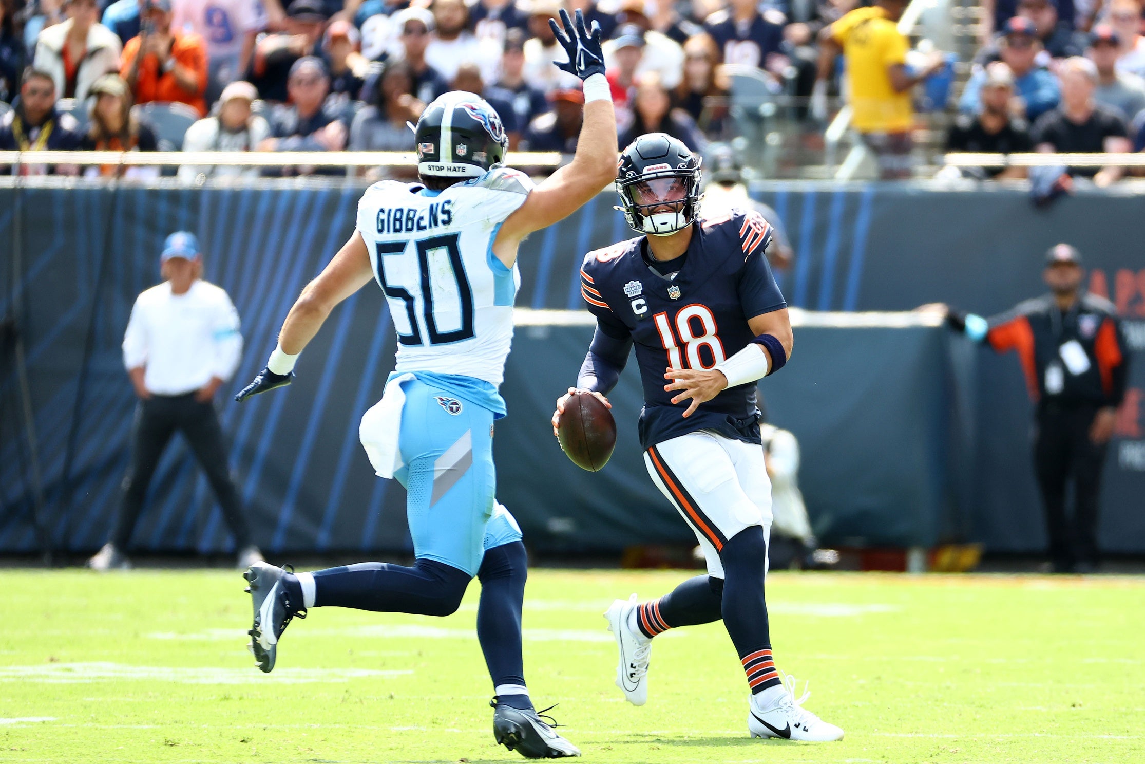 Sep 8, 2024; Chicago, Illinois, USA; Chicago Bears quarterback Caleb Williams (18) is pressured by Tennessee Titans linebacker Jack Gibbens (50) during the first quarter at Soldier Field. Mandatory Credit: Mike Dinovo-Imagn Images