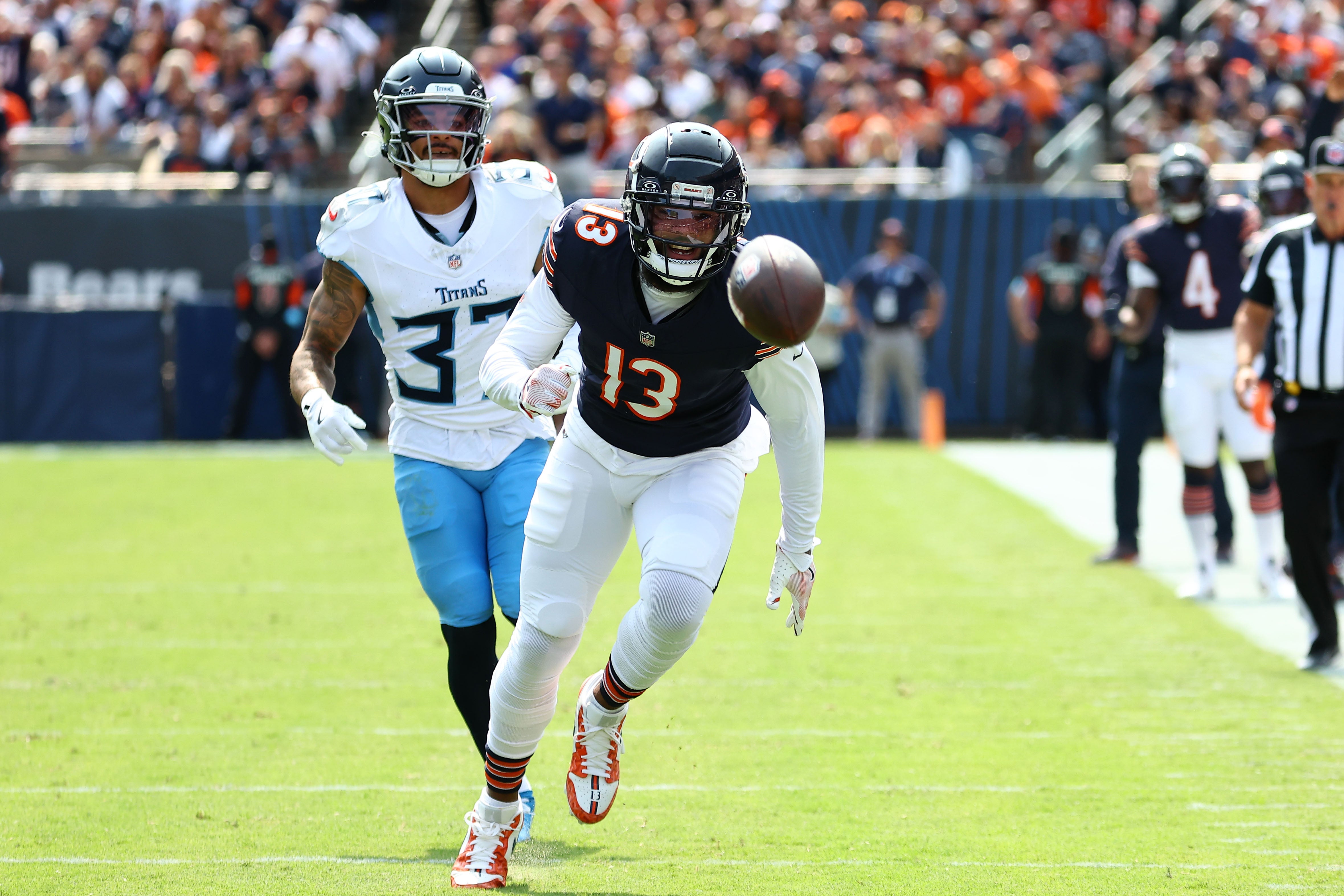 Sep 8, 2024; Chicago, Illinois, USA; Chicago Bears wide receiver Keenan Allen (13) attempts to make a catch against Tennessee Titans safety Amani Hooker (37) during the second half at Soldier Field.