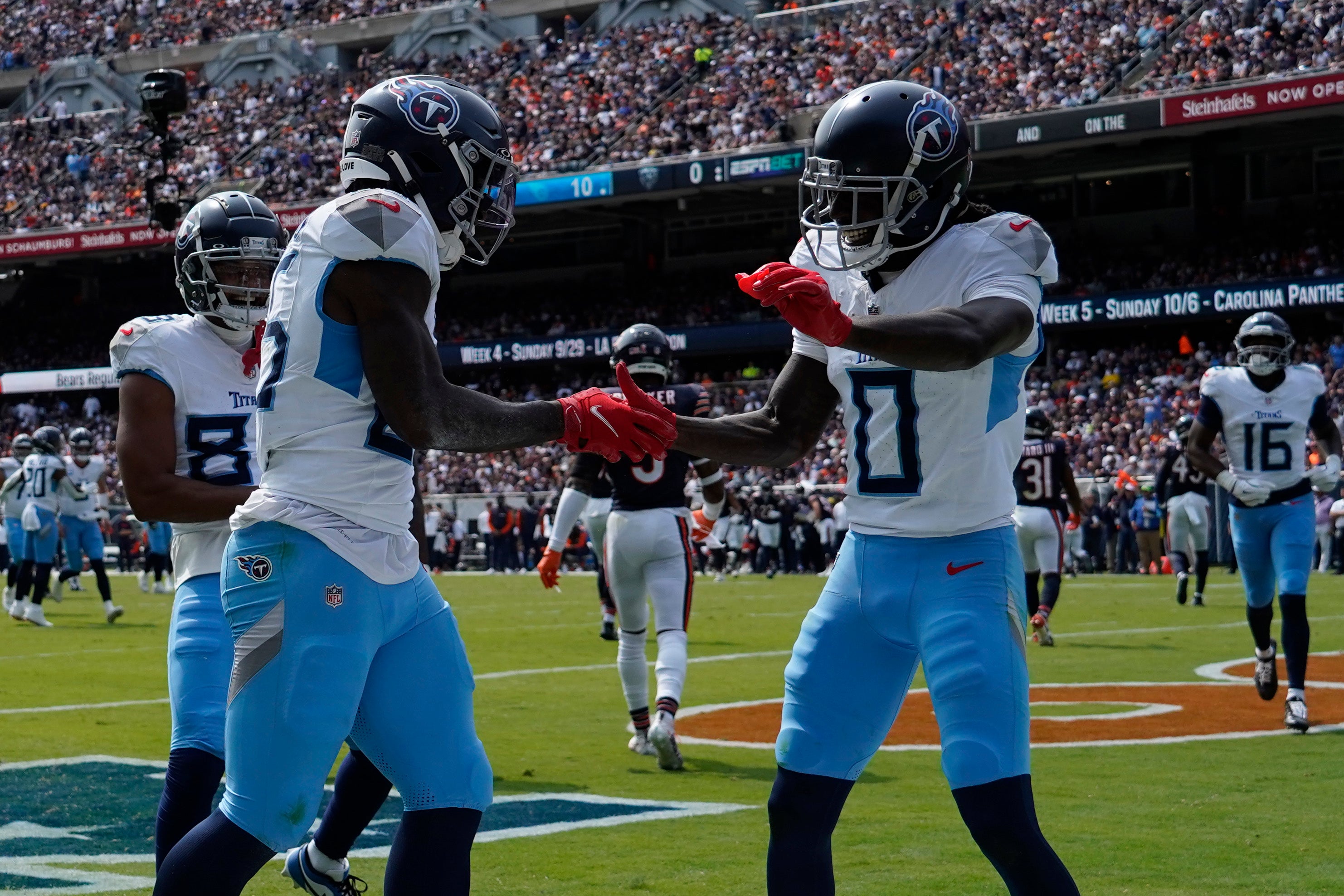 Calvin Ridley celebrates a touchdown with Chig Okonkwo