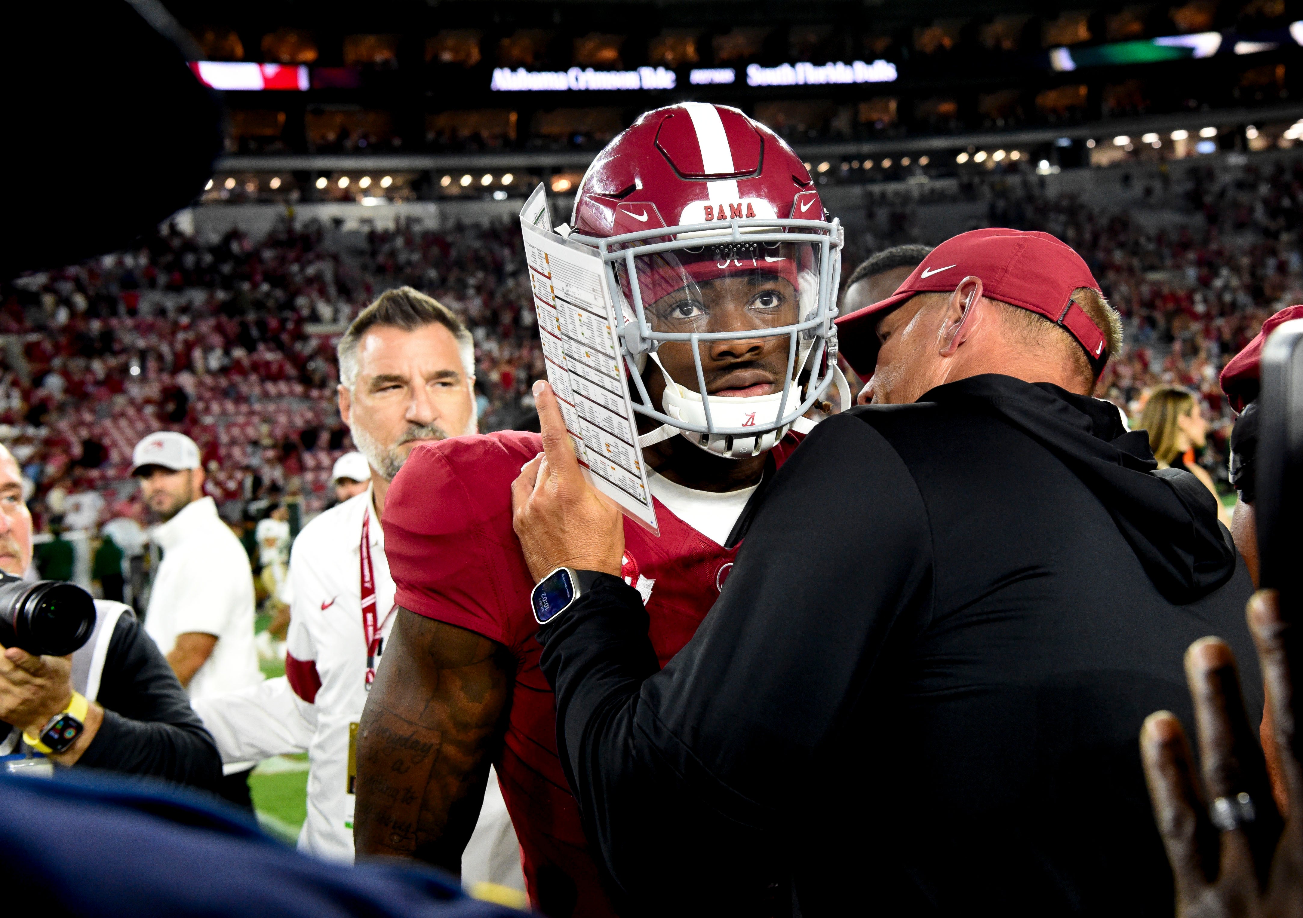 Sep 7, 2024; Tuscaloosa, Alabama, USA; Alabama Crimson Tide head coach Kalen DeBoer gives some encouragement to quarterback Jalen Milroe (4) at Bryant-Denny Stadium after defeating the South Florida Bulls. Mandatory Credit: Gary Cosby Jr.-Imagn Images