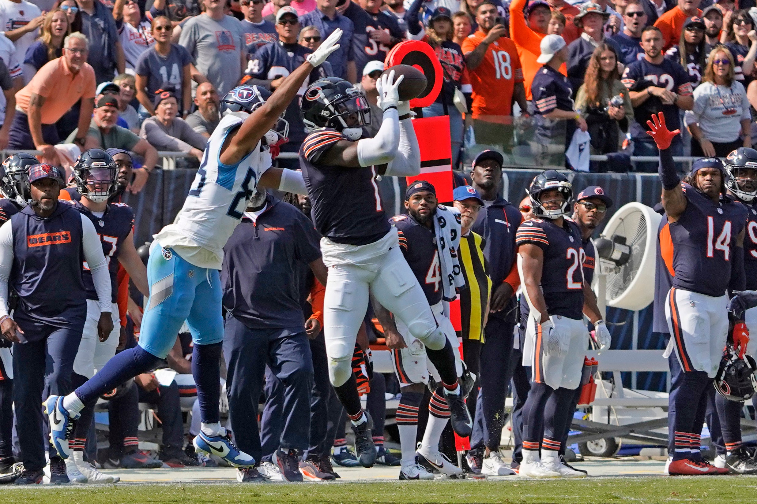 Sep 8, 2024; Chicago, Illinois, USA; Chicago Bears cornerback Jaylon Johnson (1) intercepts a pass against the Tennessee Titans during the second half at Soldier Field.