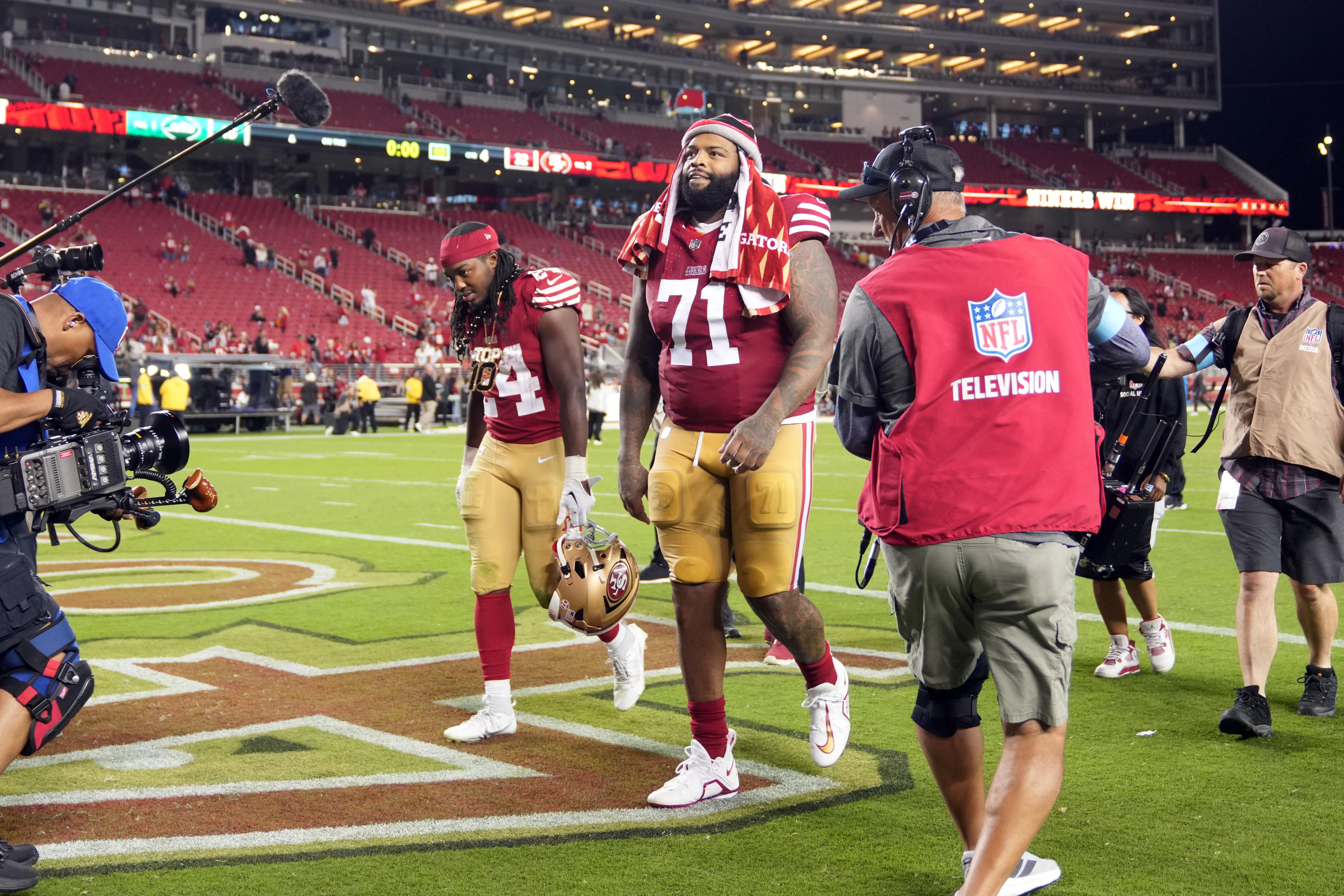 Sep 9, 2024; Santa Clara, California, USA; San Francisco 49ers offensive tackle Trent Williams (71) and running back Jordan Mason (left) walk off of the field after defeating the New York Jets at Levi's Stadium.