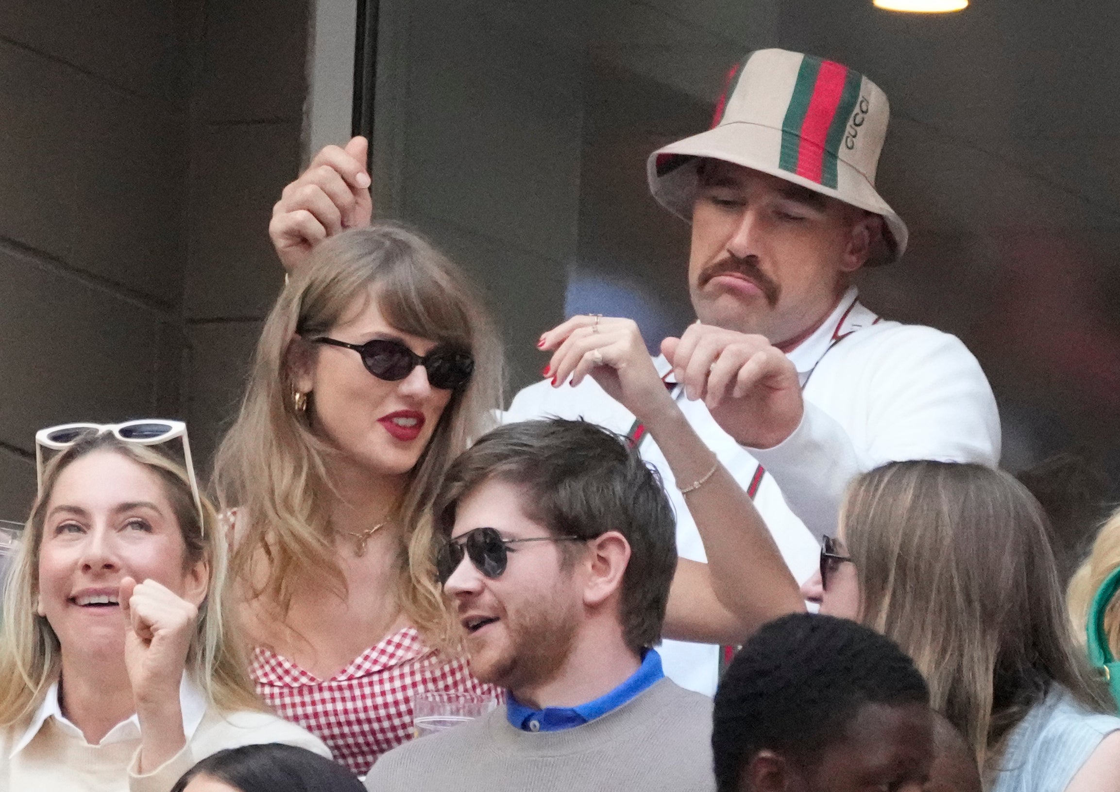Sep 8, 2024; Flushing, NY, USA; Recording artist Taylor Swift and Kansas City Chiefs tight end Travis Kelce talk during the men’s singles final of the 2024 U.S. Open tennis tournament at USTA Billie Jean King National Tennis Center.