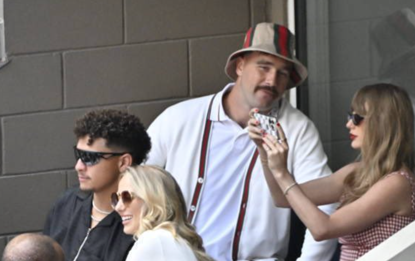Taylor Swift takes a photo of Patrick and Brittany Mahomes at the US Open.