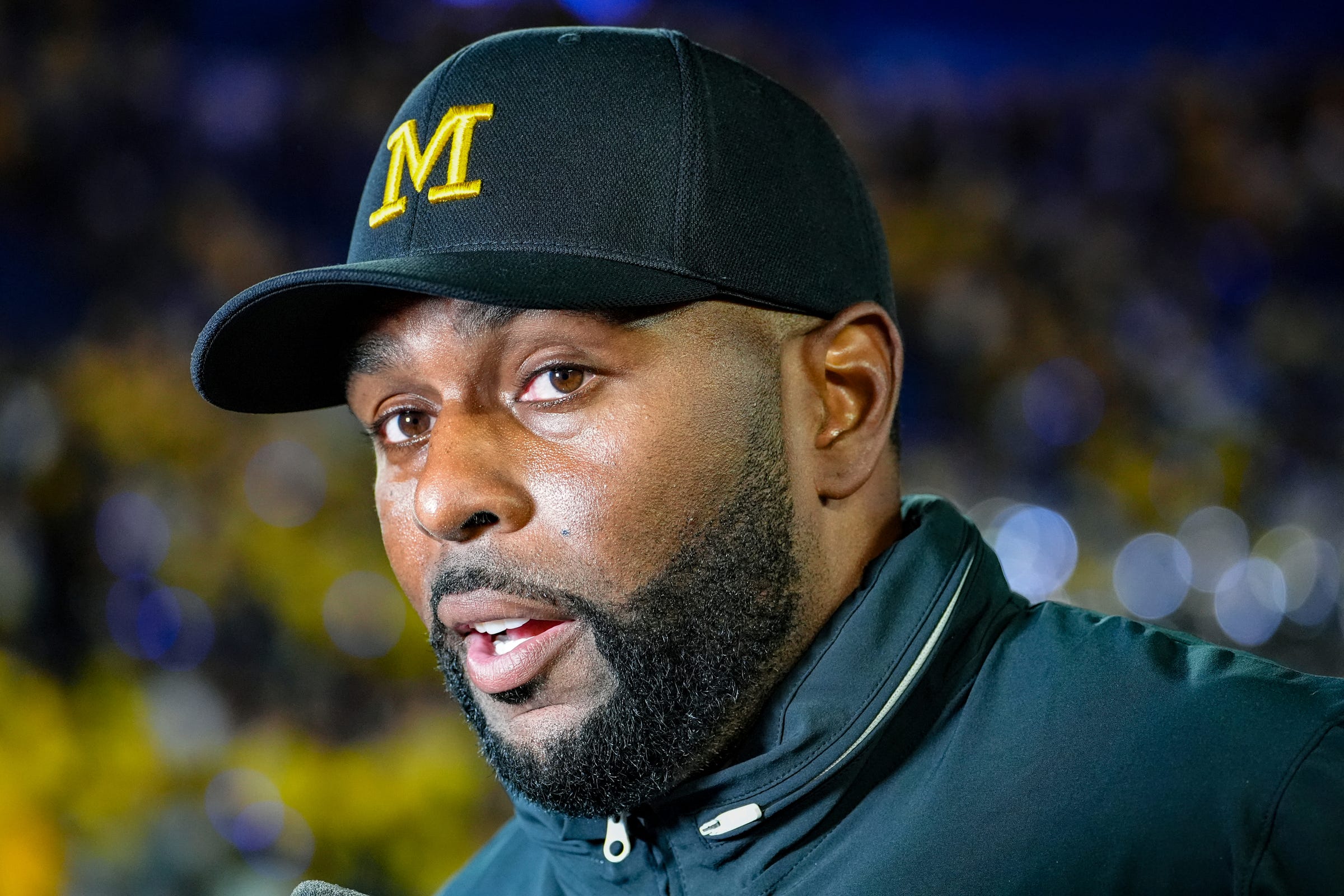 Michigan head coach Sherrone Moore speaks to the media