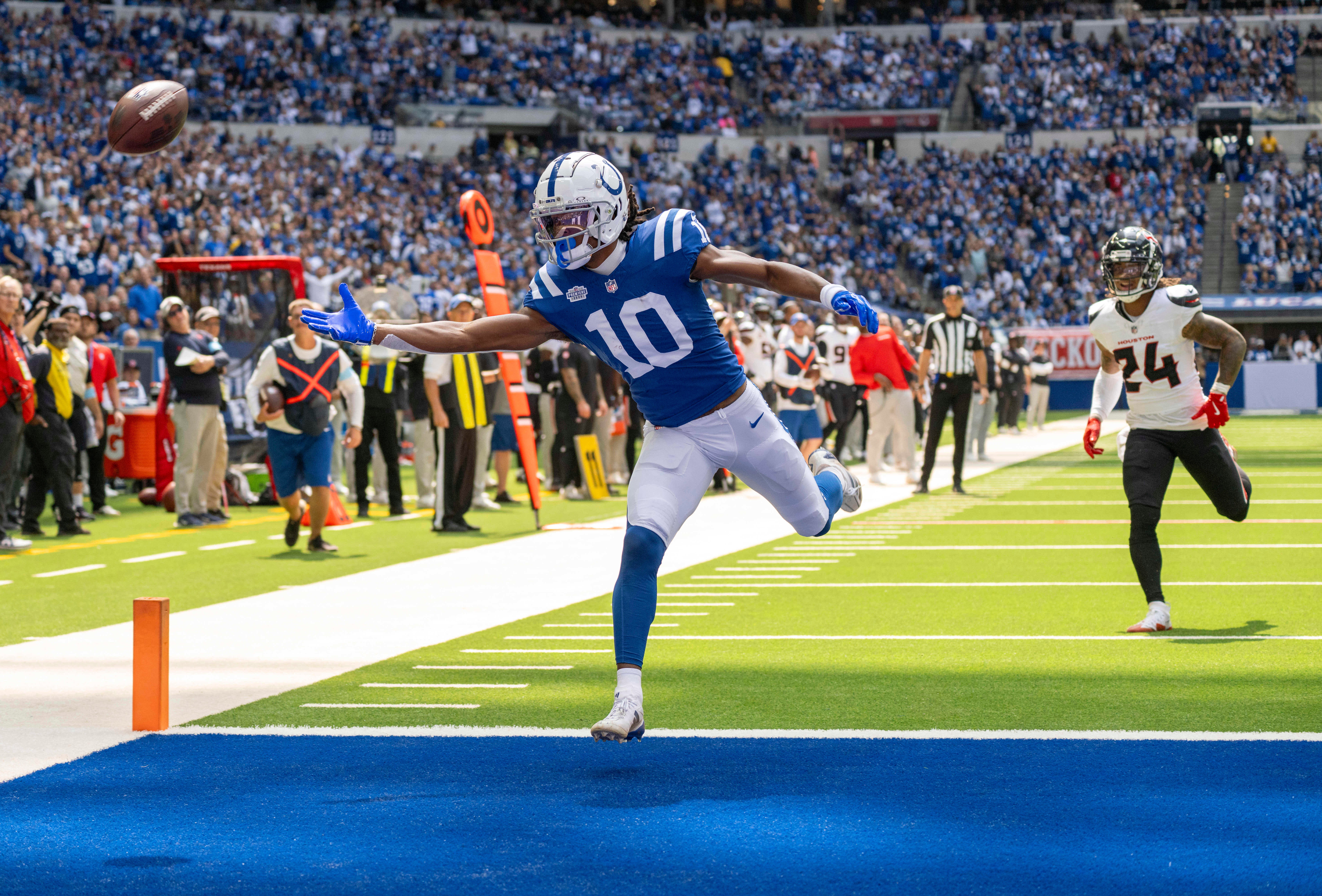 Sep 8, 2024; Indianapolis, Indiana, USA; Indianapolis Colts wide receiver Adonai Mitchell (10) reaches for an overthrown pass in front of Houston Texans cornerback Derek Stingley Jr. (24) during the second quarter at Lucas Oil Stadium.