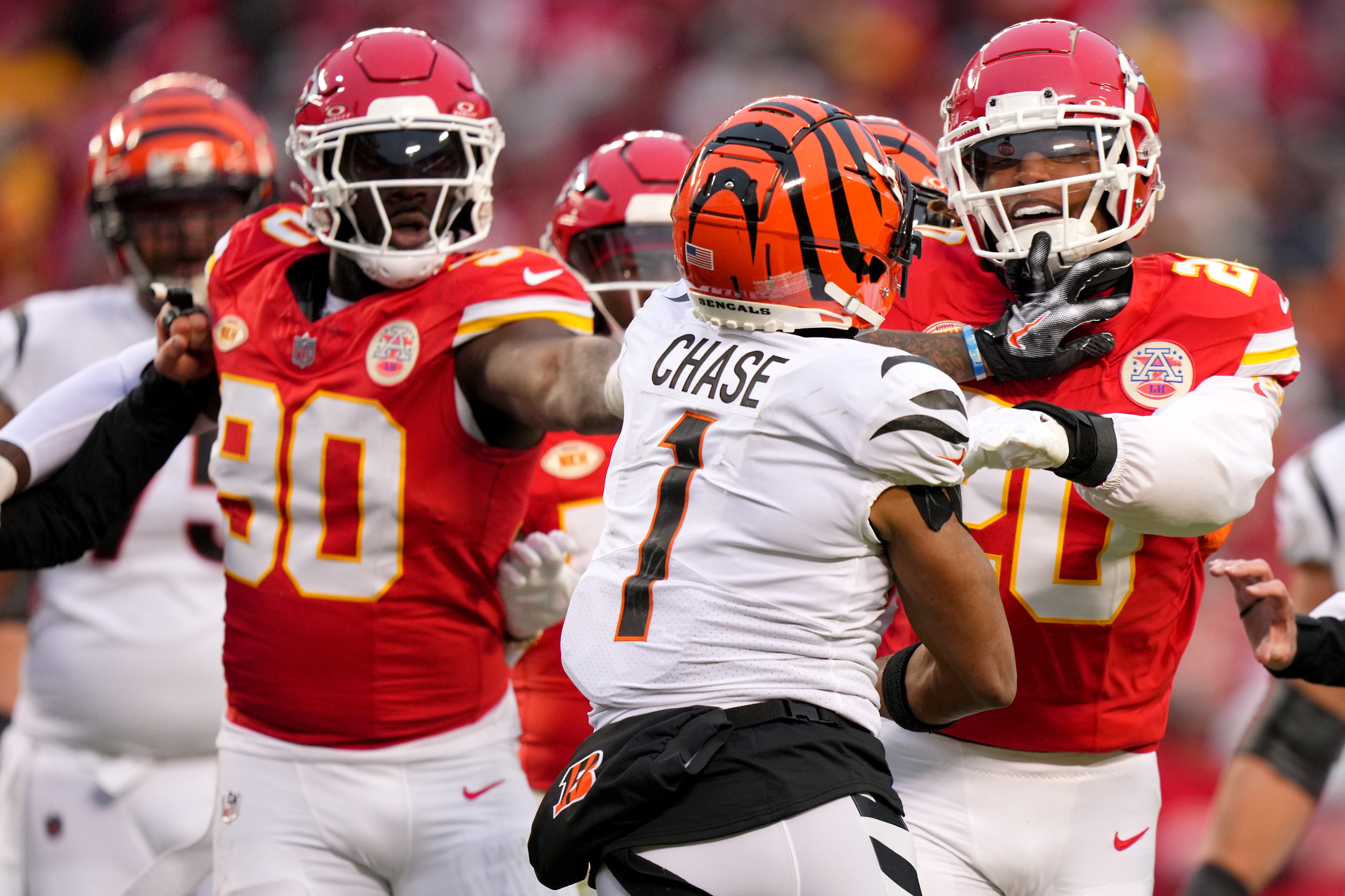 Cincinnati Bengals wide receiver Ja'Marr Chase (1) and Kansas City Chiefs safety Justin Reid (20) exchange shoves in the second quarter during a Week 17 NFL football game between the Cincinnati Bengals and the Kansas City Chiefs, Sunday, Dec. 31, 2023, at GEHA Field at Arrowhead Stadium in Kansas City, Mo.
