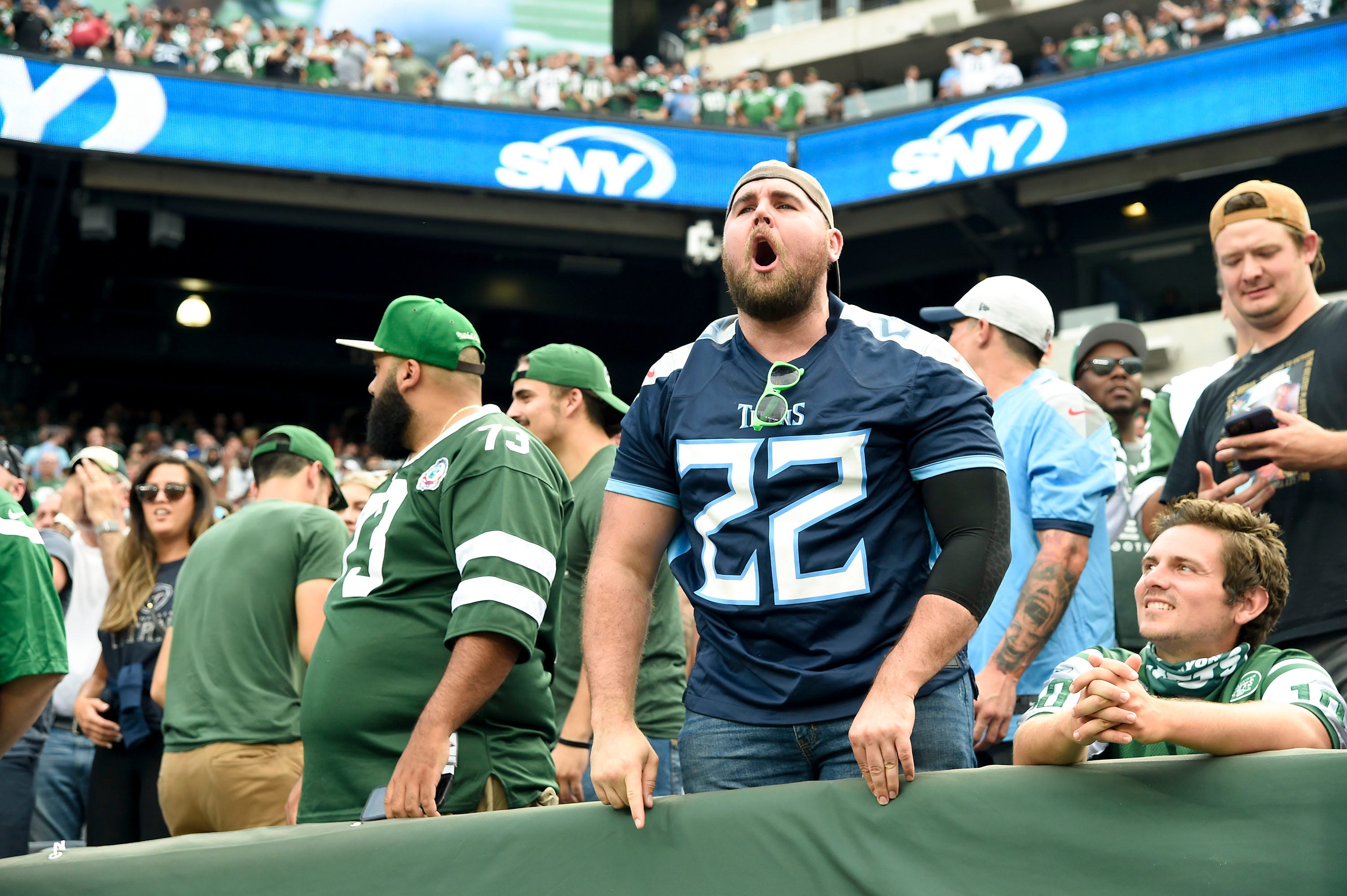 A Titans fan roll eats as his team falls to the Jets at MetLife Stadium Sunday, Oct. 3, 2021 in East Rutherford, N.J. Titans Jets 11 George Walker IV / Tennessean.com-USA TODAY NETWORK