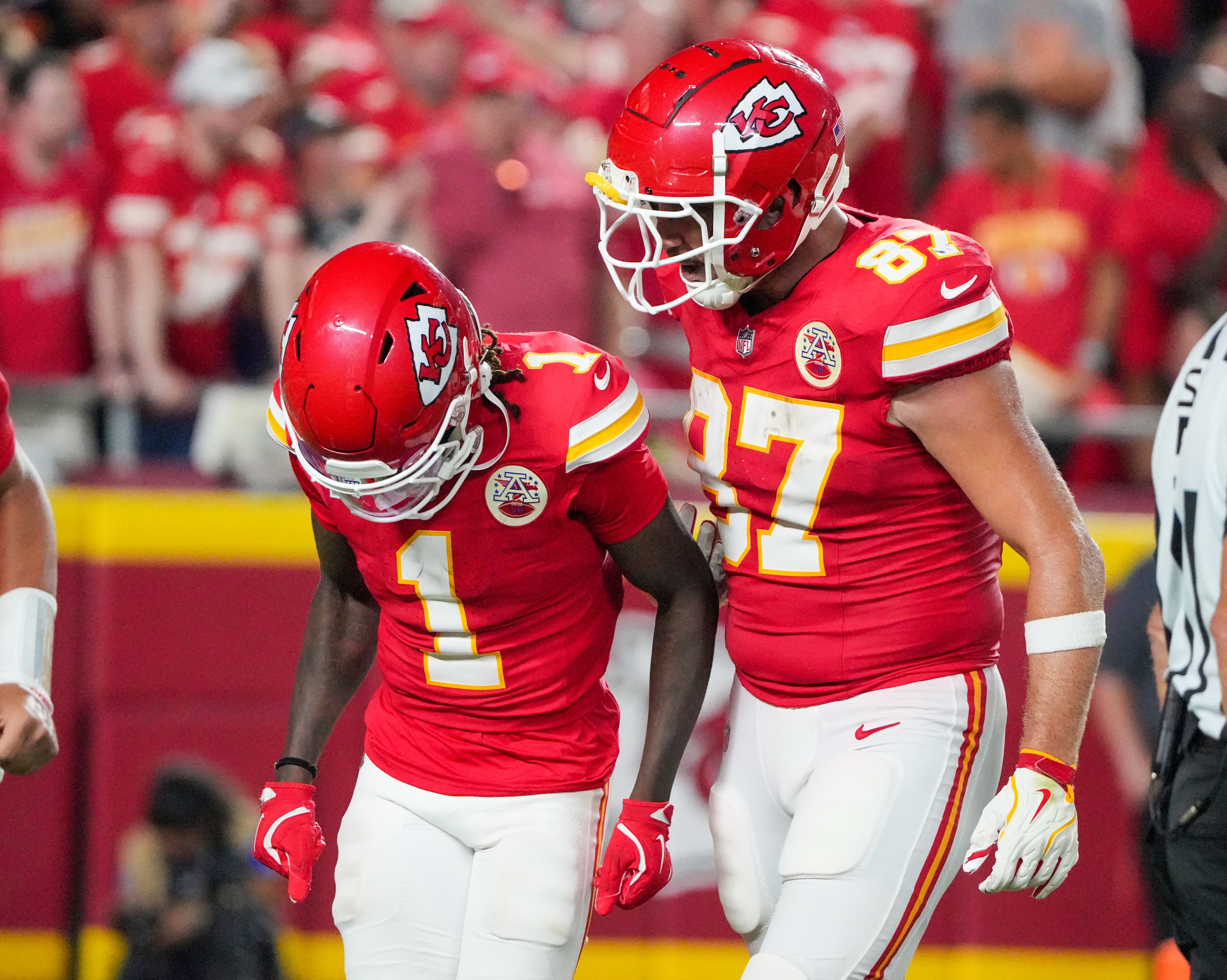 Sep 5, 2024; Kansas City, Missouri, USA; Kansas City Chiefs tight end Travis Kelce (87) celebrates with wide receiver Xavier Worthy (1) after a touchdown agains the Baltimore Ravens during the second half at GEHA Field at Arrowhead Stadium.