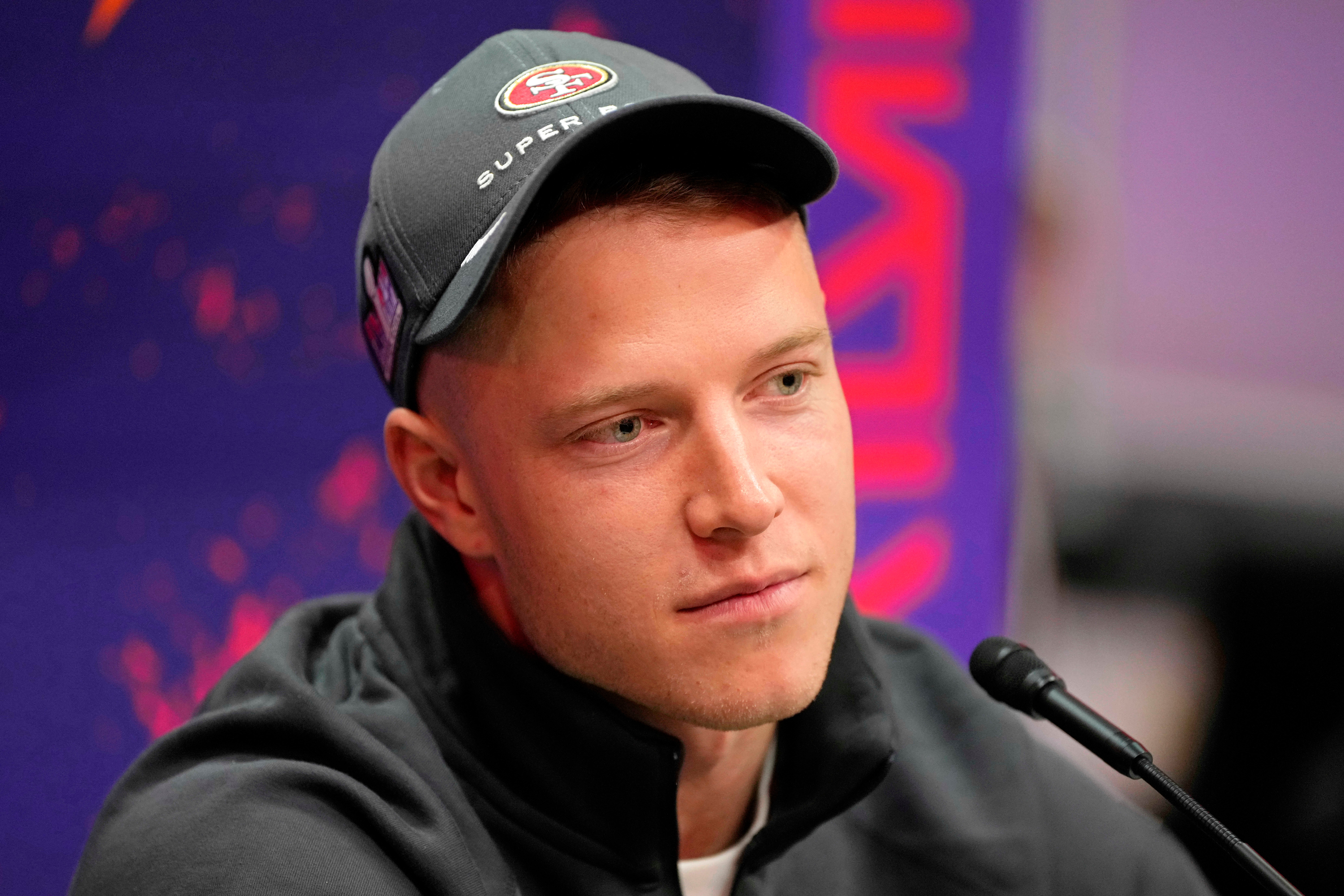 Feb 5, 2024; Las Vegas, NV, USA; San Francisco 49ers running back Christian McCaffrey (23) talks to the media during Super Bowl LVIII Opening Night at Allegiant Stadium.