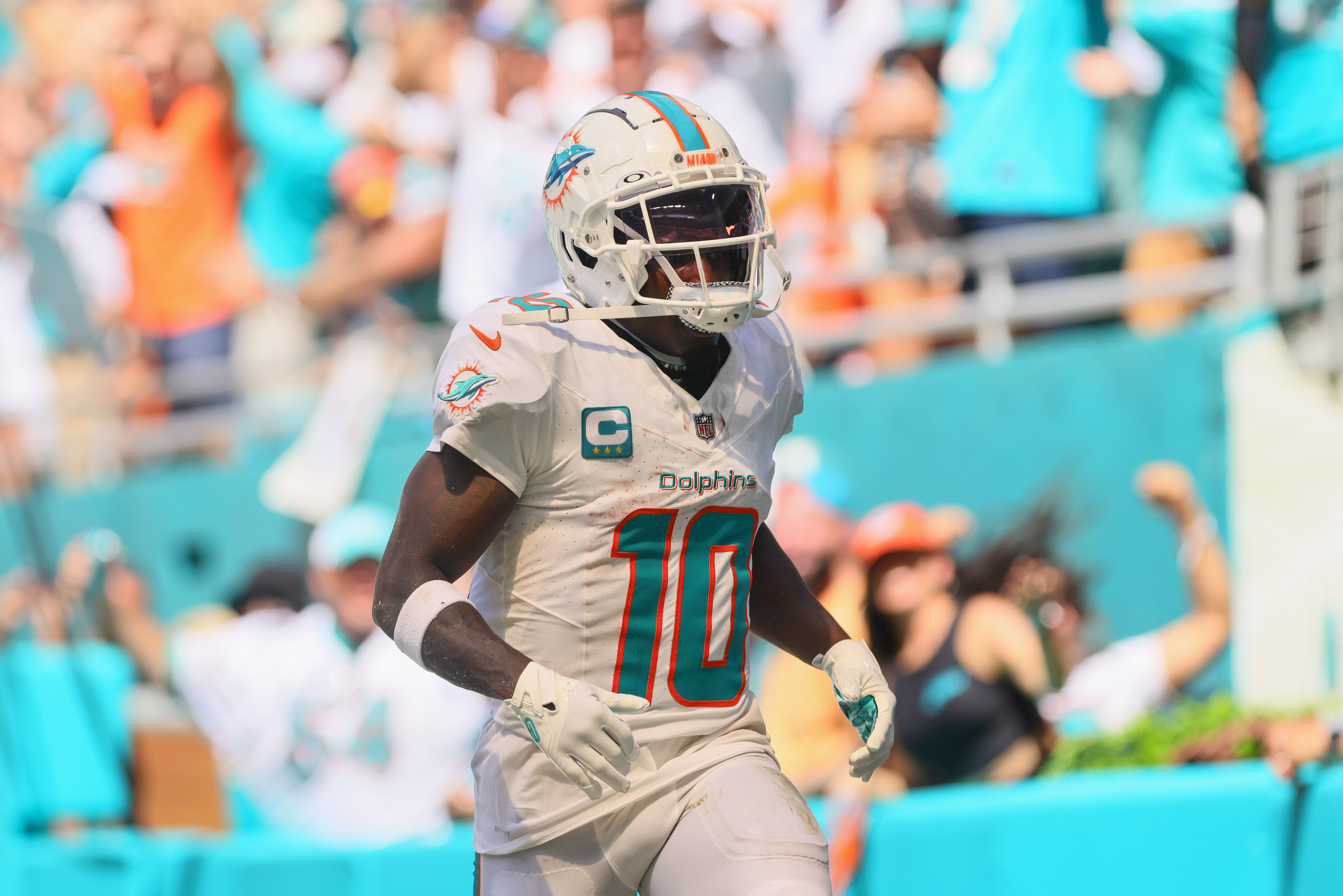 Sep 8, 2024; Miami Gardens, Florida, USA; Miami Dolphins wide receiver Tyreek Hill (10) runs in the end zone after scoring a touchdown against the Jacksonville Jaguars during the third quarter at Hard Rock Stadium.
