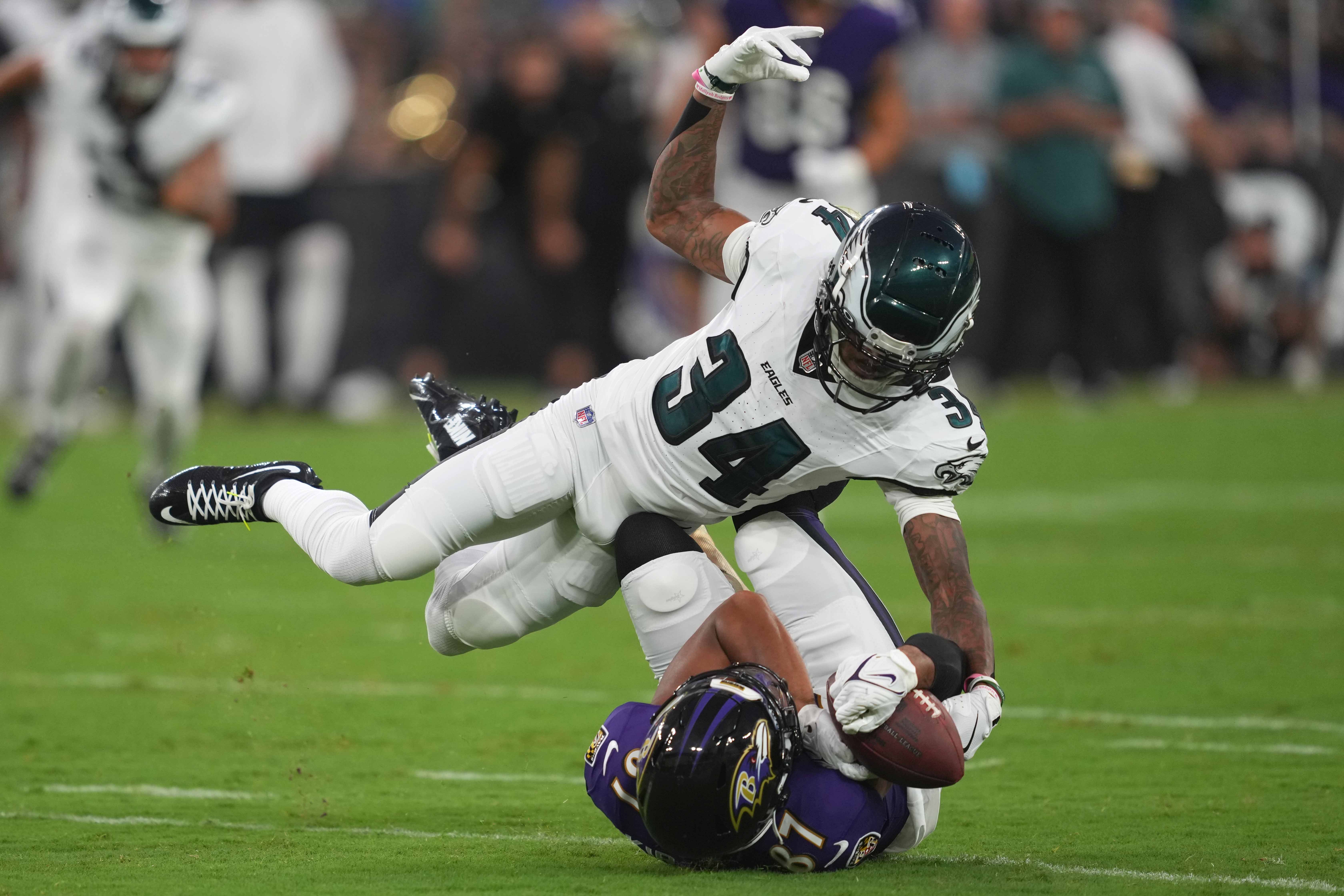 Baltimore Ravens wide receiver Keith Kirkwood (87) tackled after his second quarter catch by Philadelphia Eagles cornerback Isaiah Rodgers (34) at M&T Bank Stadium.