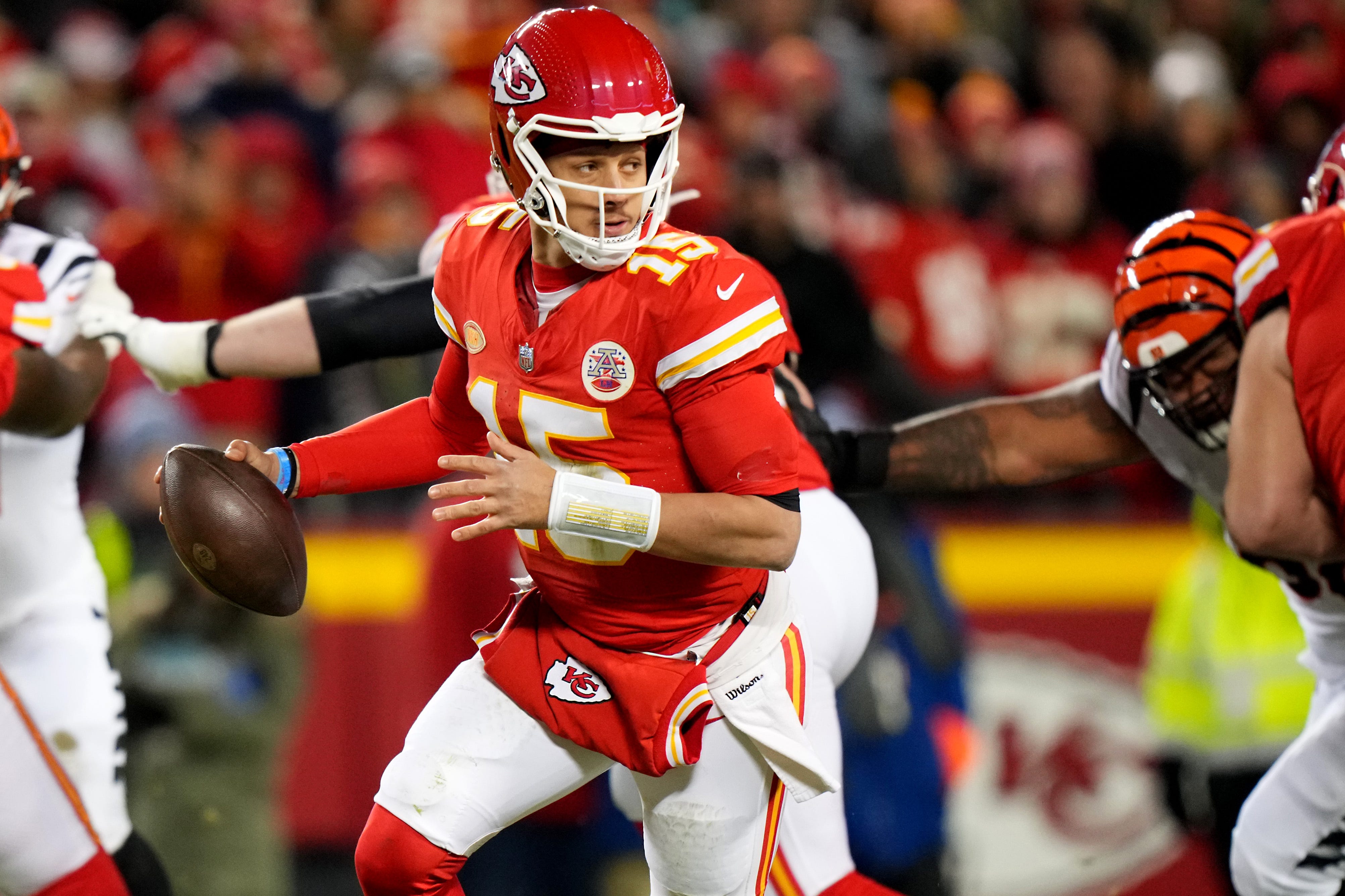 Kansas City Chiefs quarterback Patrick Mahomes (15) roll out of the pocket in the third quarter during a Week 17 NFL football game between the Cincinnati Bengals and the Kansas City Chiefs, Sunday, Dec. 31, 2023, at GEHA Field at Arrowhead Stadium in Kansas City, Mo. The Kansas City Chiefs won, 25-17.
